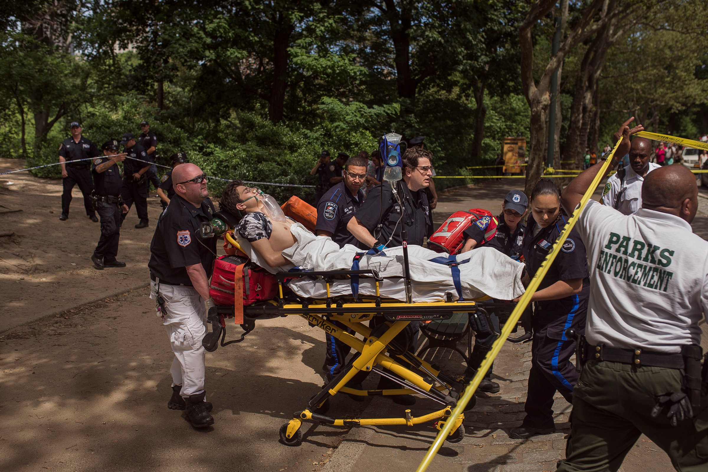 A injured man is carried to an ambulance in Central Park in New York City on July 3, 2016.