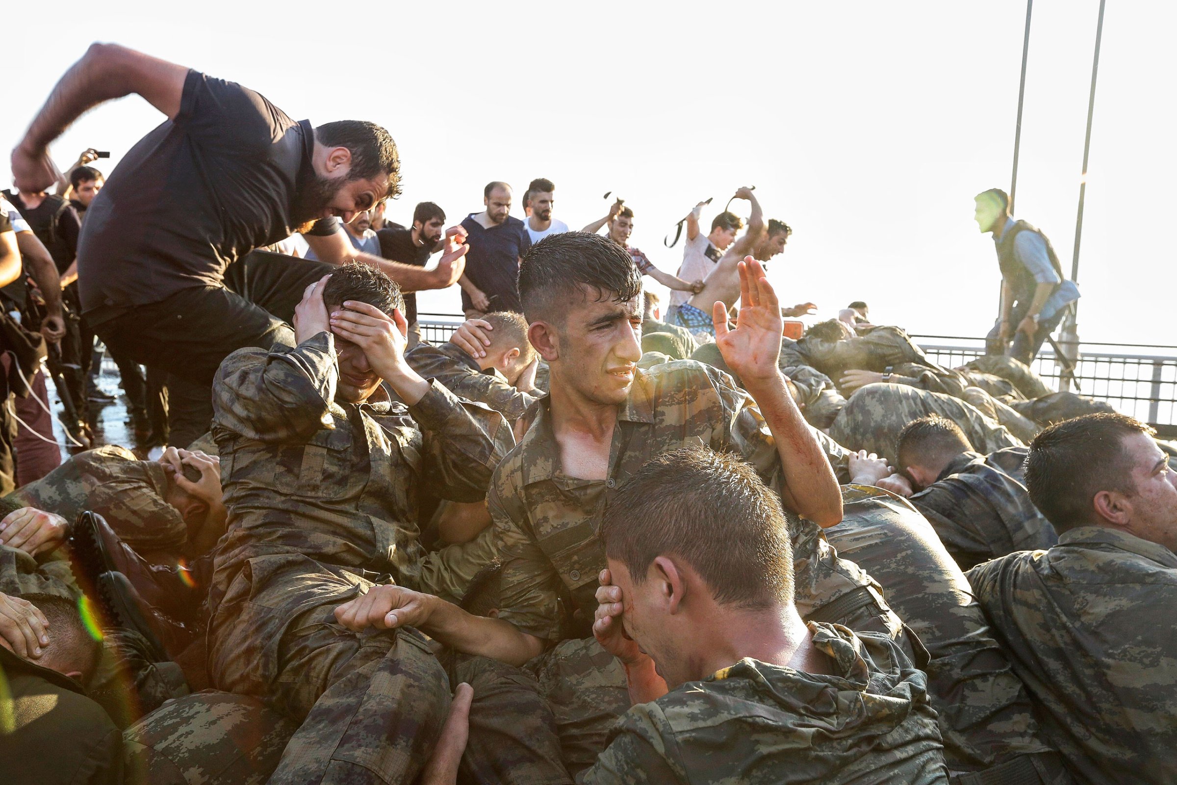 Soldiers involved in the attempted coup surrender on the Bosporus Bridge in Istanbul early on July 16; thousands of suspected plotters were later rounded up