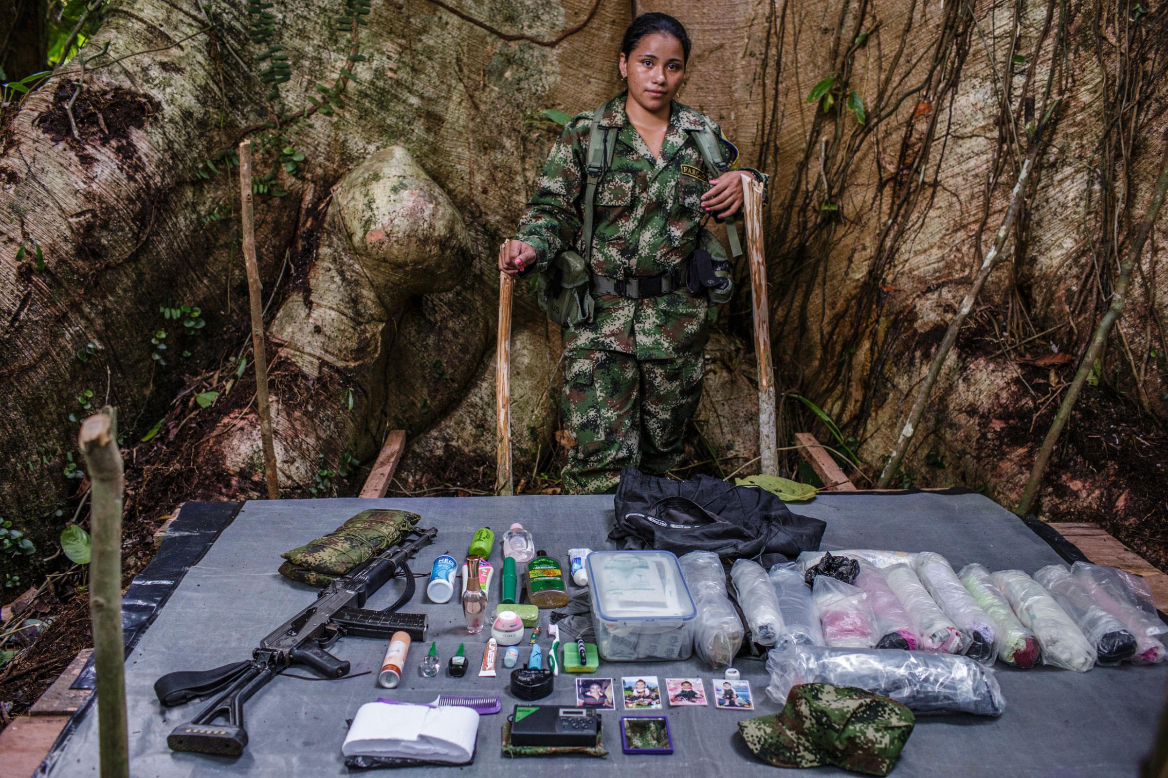"Katherine," 20-years old, has been with FARC for seven years. She has five older brothers, all of whom are guerrilla fighters. Katherine is a nurse who works with the FARC medical team. Her nine-month-old daughter lives with her grandmother.
