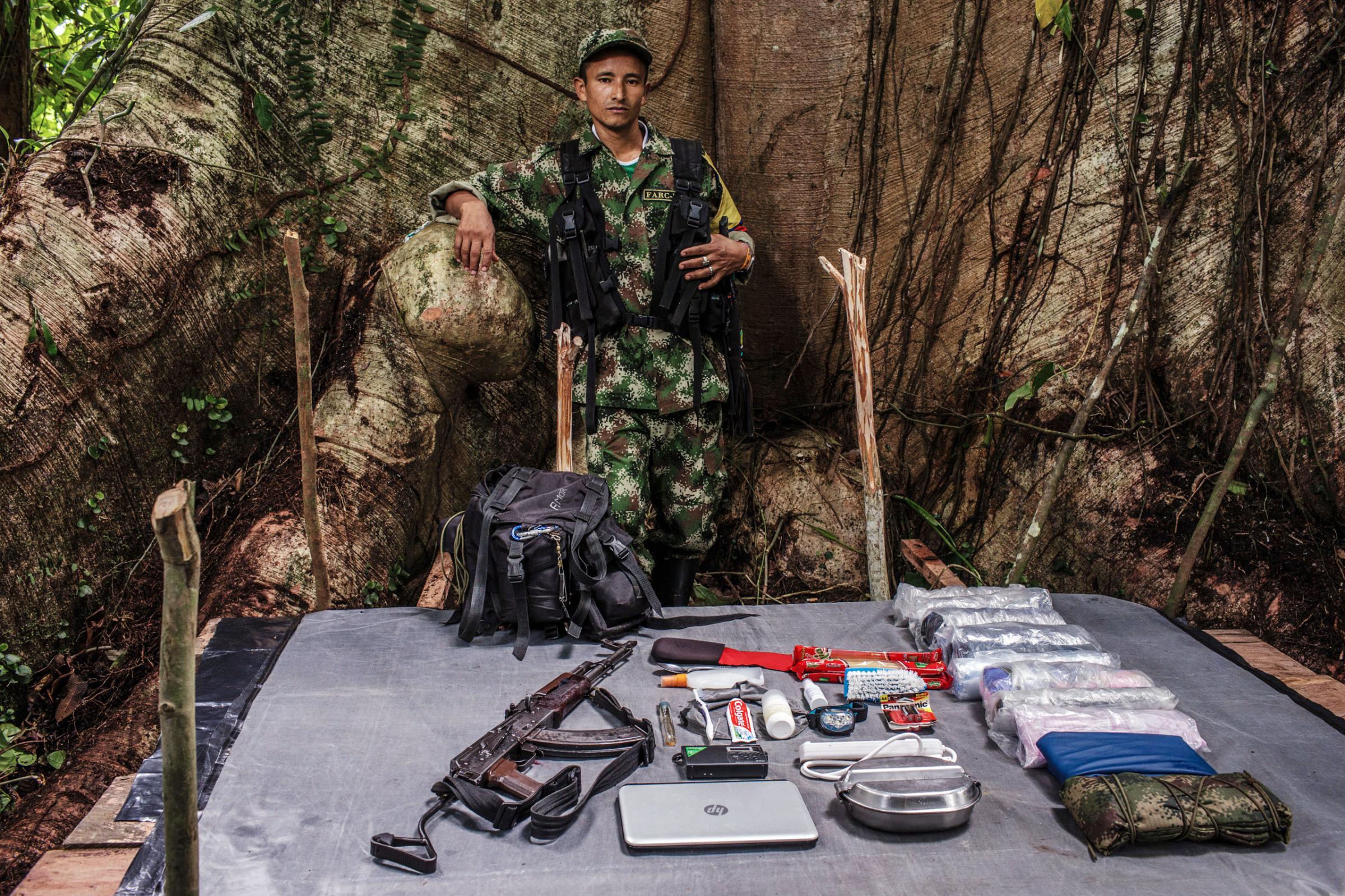 Didier, 37 years old, has been with FARC for 19 years. He carries an AK47 and a laptop for intelligence missions.