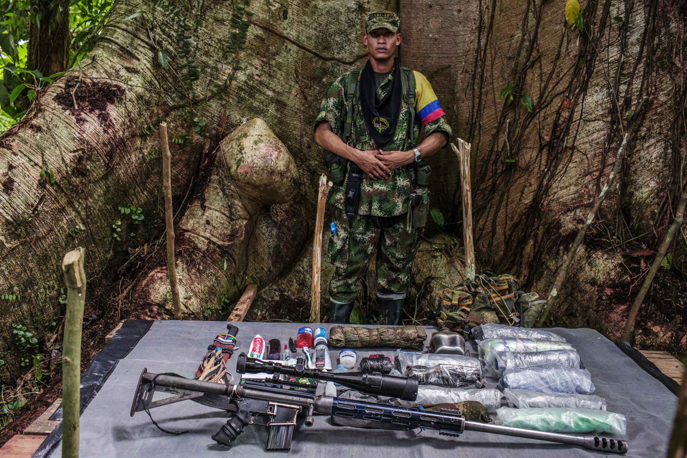 "Oswaldo," 22-years old, has been with FARC for 10 years. Because OswaldoÕs position is on the frontline, he is armed with heavy artillery. His weapon is handcrafted to combine a .50 rifle and a machine gun.