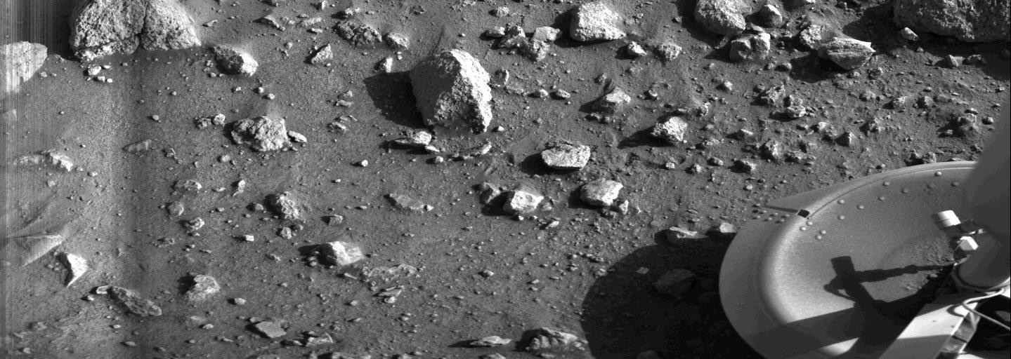 Taken by the Viking 1 lander shortly after it touched down, this image is the first photograph ever taken from the surface of Mars, July 20, 1976.