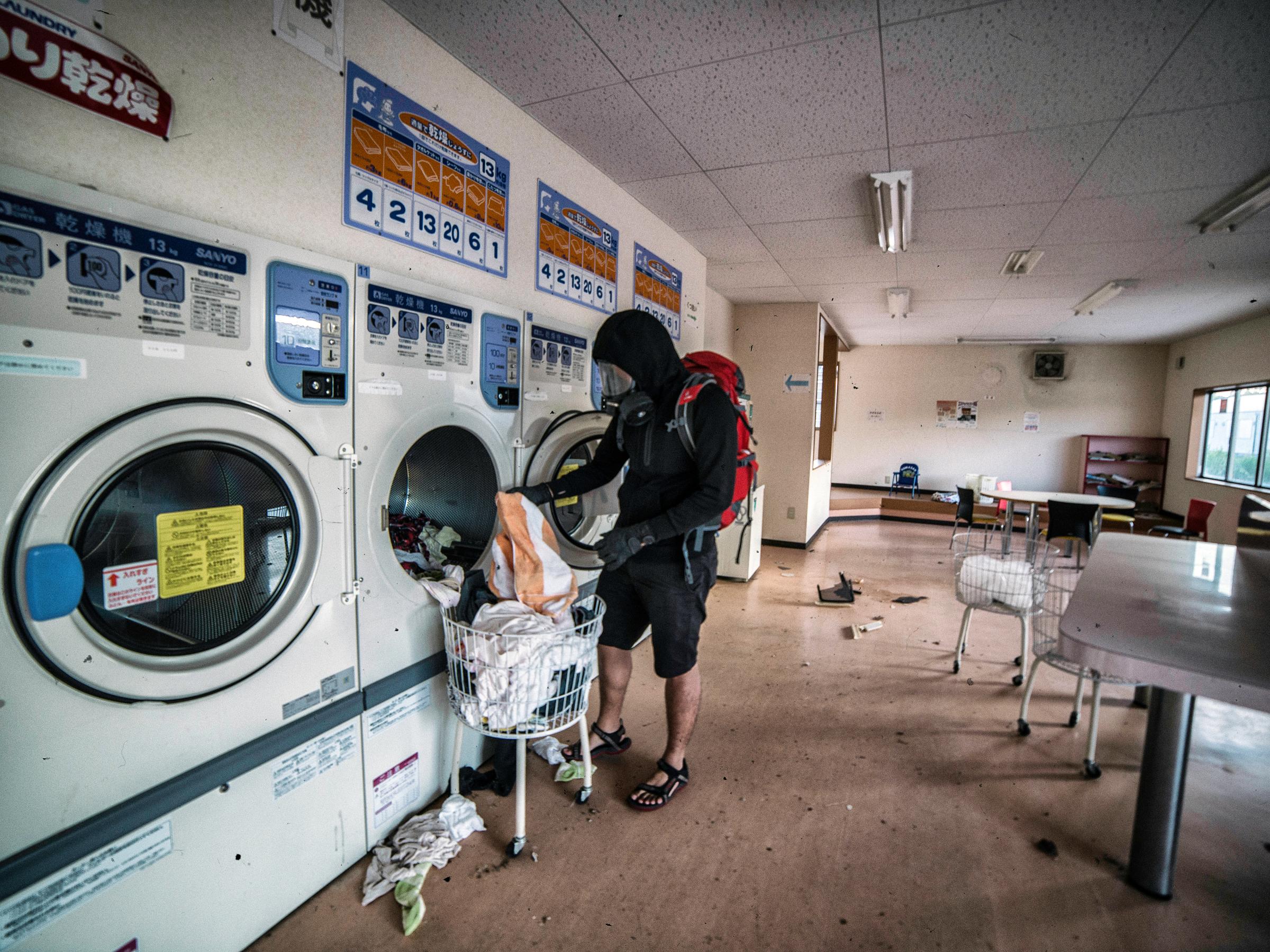 The photographer "does laundry" at a laundromat in Futaba.