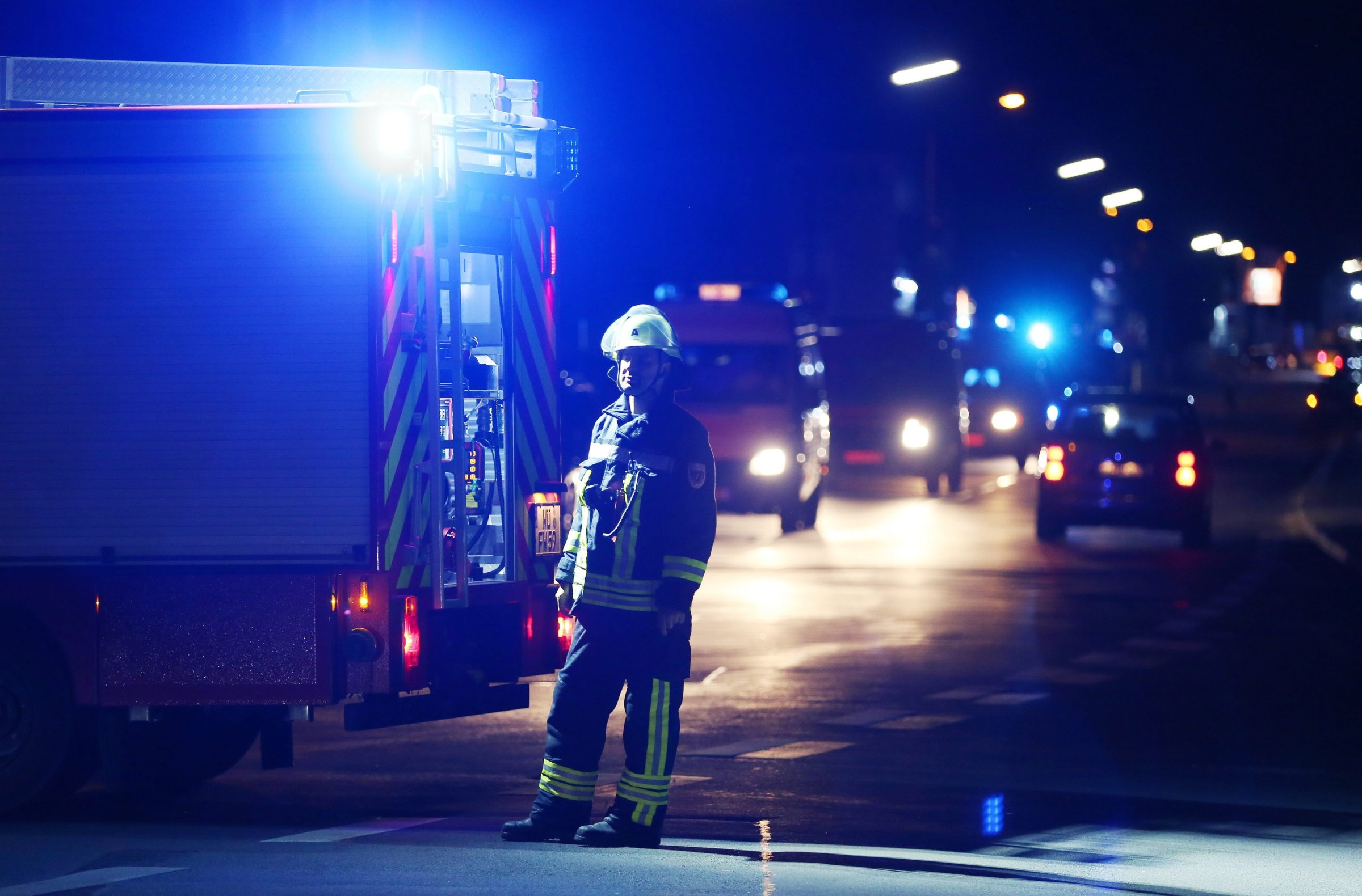 A firefighter stands at a road block in Wuerzburg, Germany, July 18, 2016. Reports state that a man allegedly wielding an axe injured multiple passengers on a regional train in Wuerzburg.