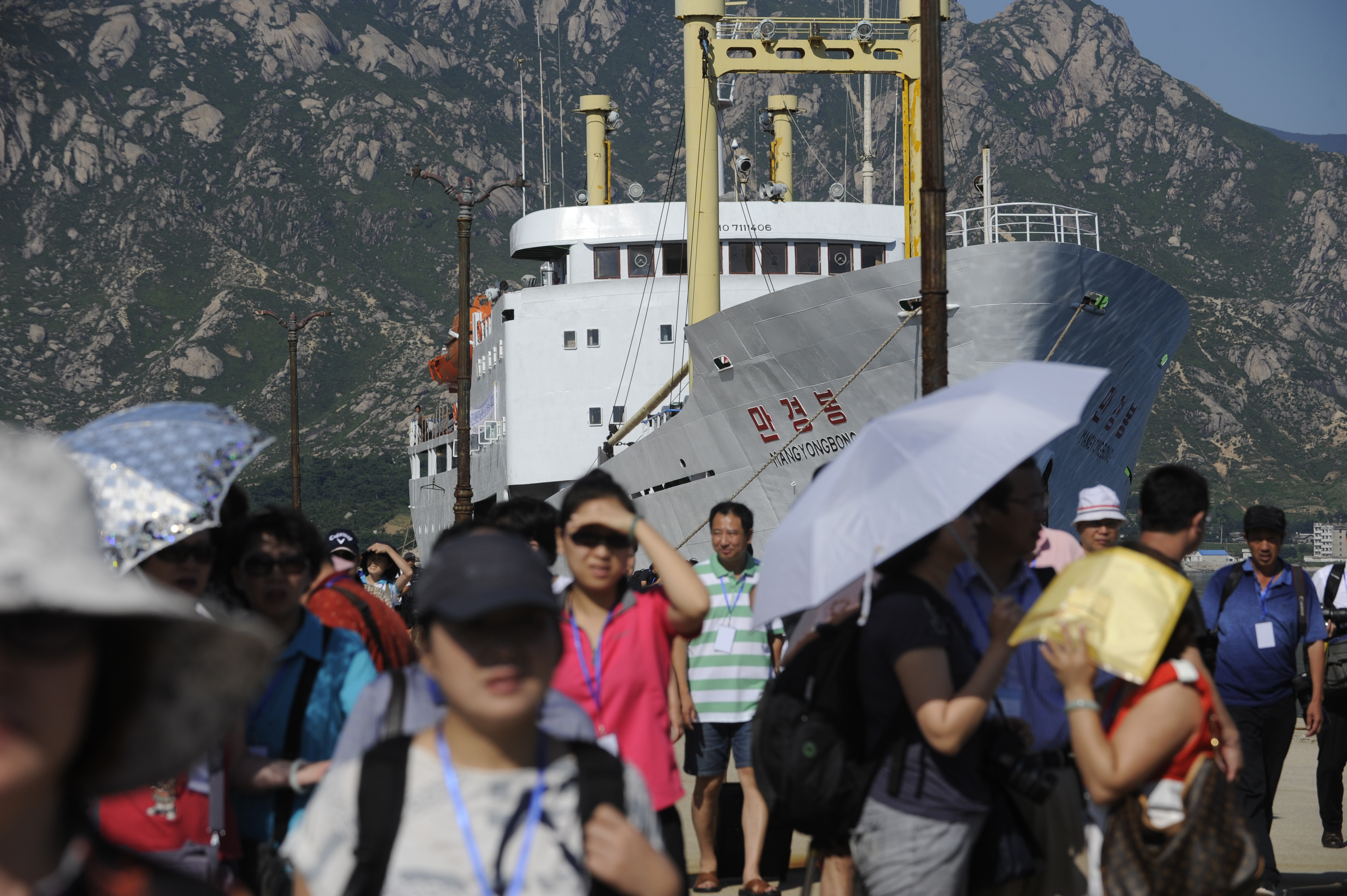 Chinese tourists make their way from the cruise ship <i>Mangyongbong</i> after docking at Mount Kumgang port in the first-ever cruise from Rason in North Korea on Aug. 30, 2011 (Goh Chai— AFP/Getty Images)