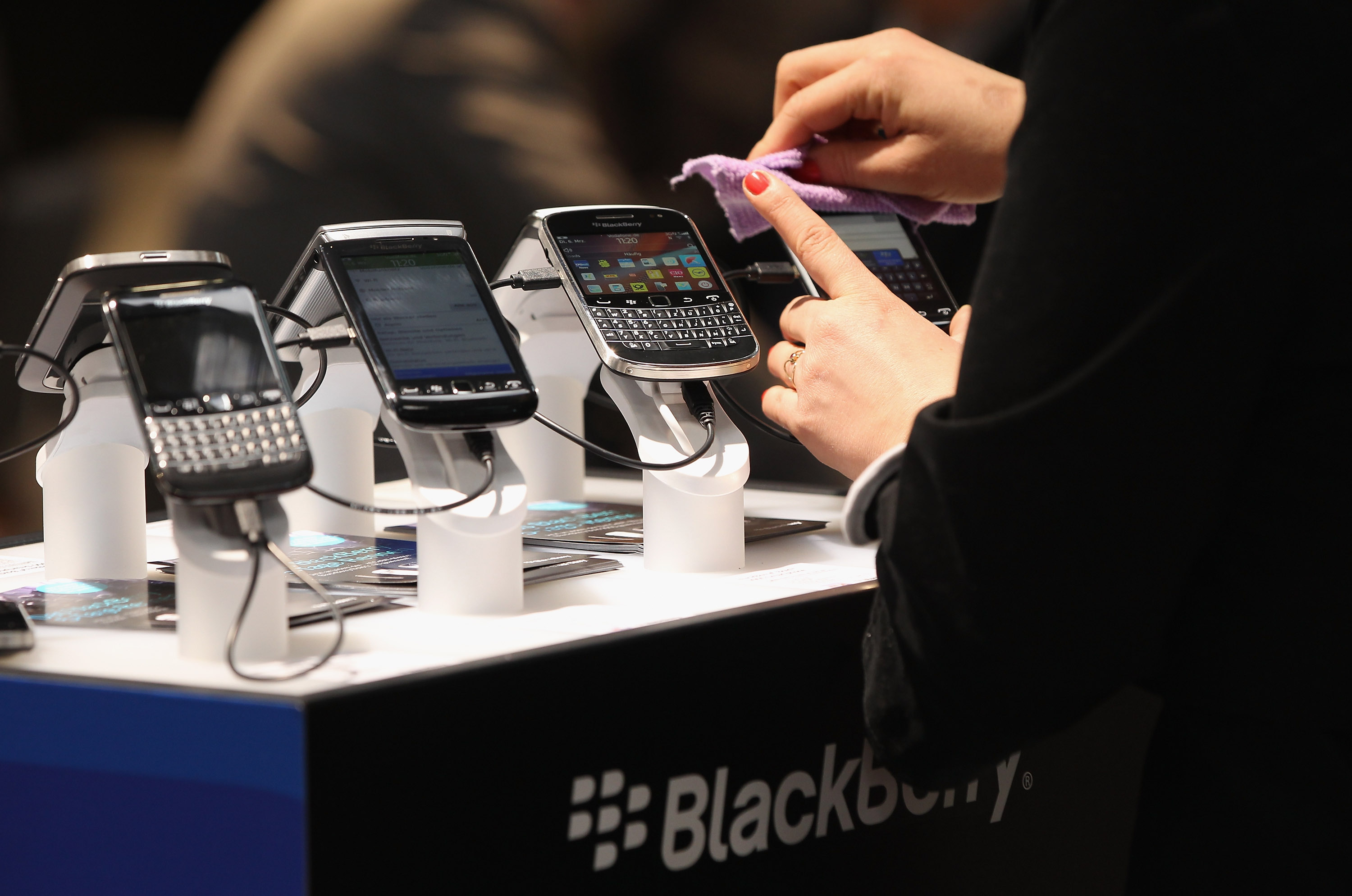 Visitors try out Blackberry smartphones at the Blackberry stand on the first day of the CeBIT 2012 technology trade fair on March 6, 2012 in Hanover, Germany. (Sean Gallup&mdash;Getty Images)