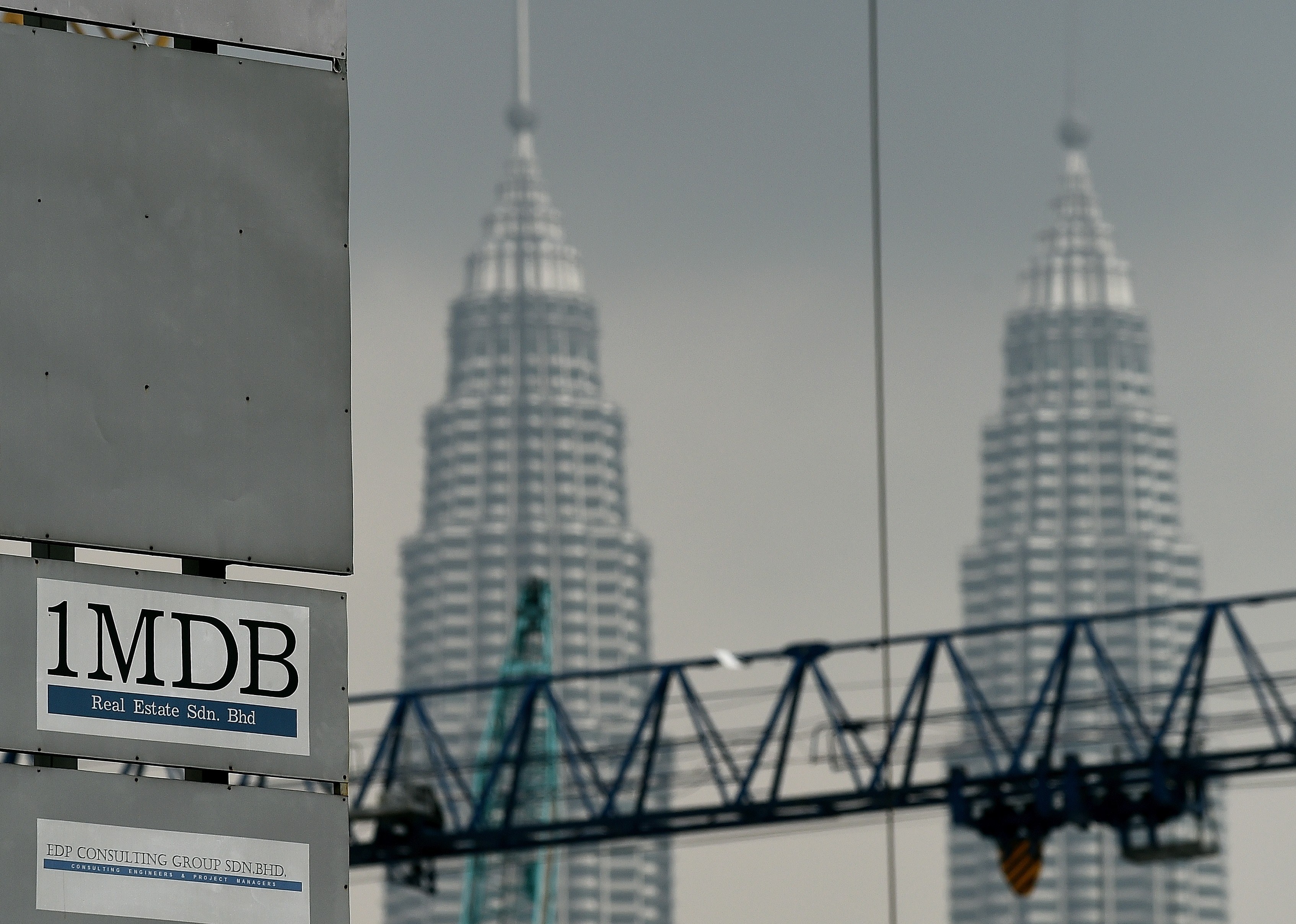 The 1MDB logo is seen on a billboard in Kuala Lumpur on July 3, 2015 (Manan Vatsyayana—AFP/Getty Images)