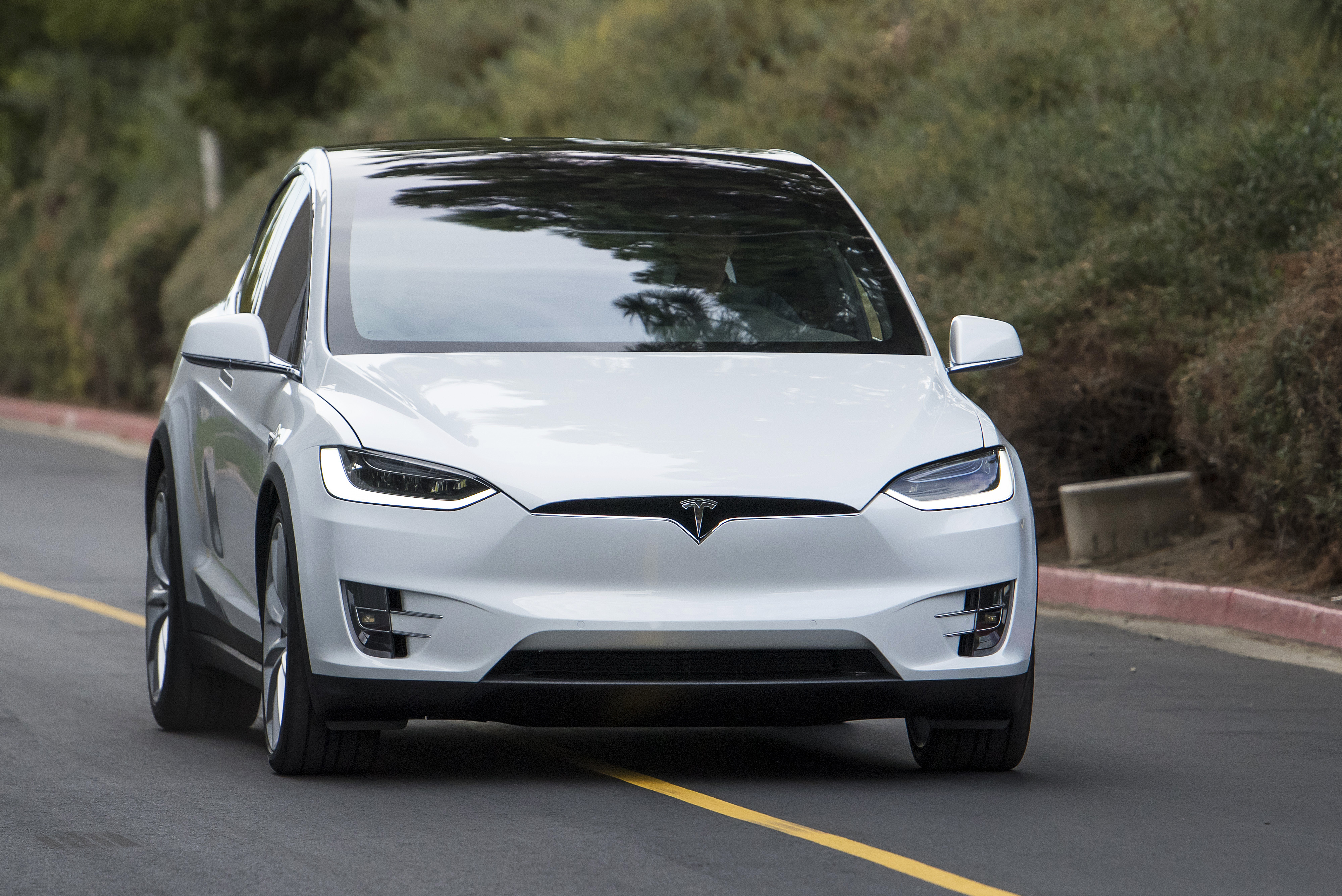 The Tesla Motors Inc. Model X sport utility vehicle (SUV) is driven during an event in Fremont, California, U.S., on Tuesday, Sept. 29, 2015. (Bloomberg/Getty Images)