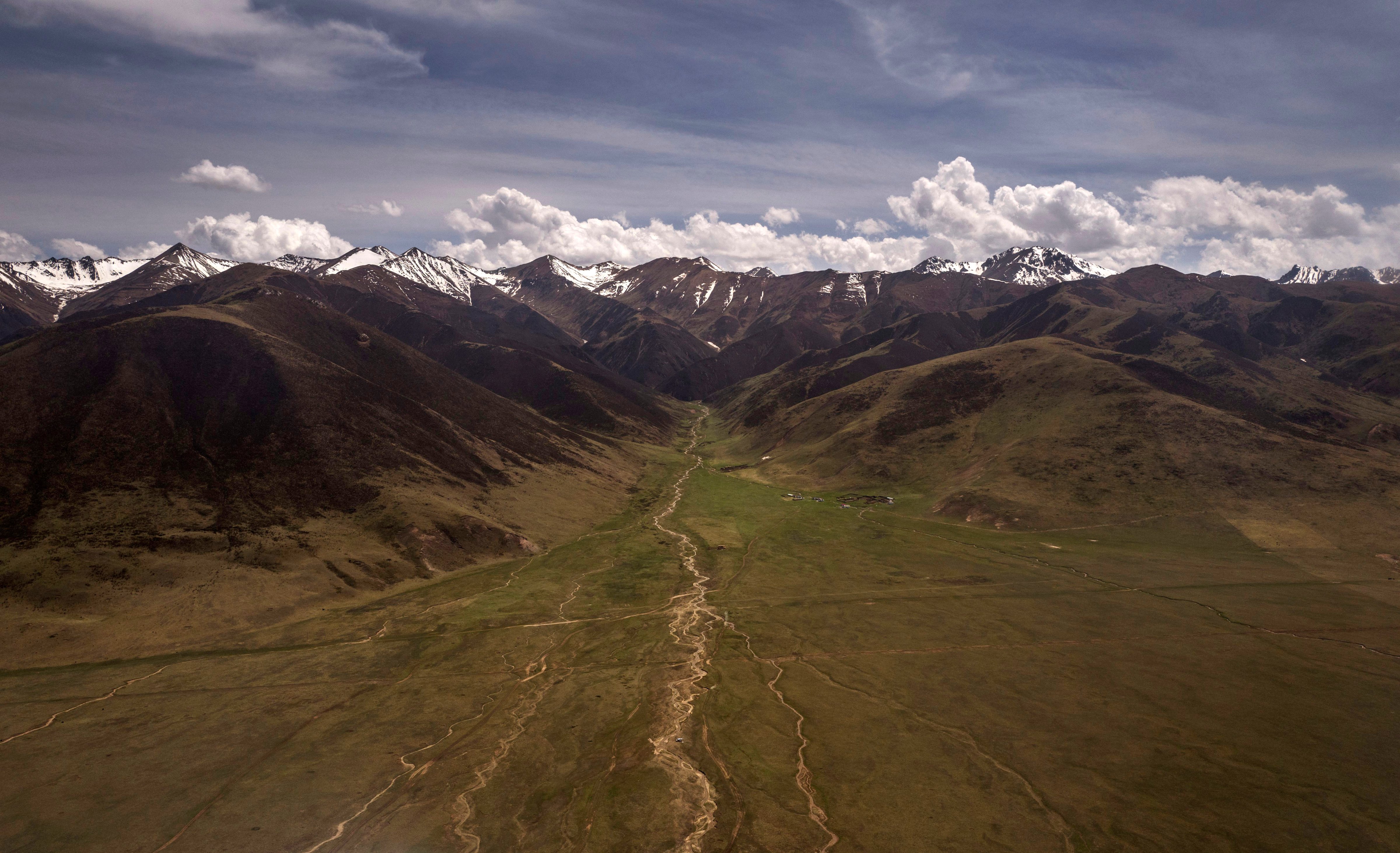 The mountains and grasslands of the Tibetan Plateau are seen from the air in the Yushu Tibetan Autonomous Prefecture of Qinghai province on May 24, 2016 in Yushu, China. (Kevin Frayer—Getty Images)