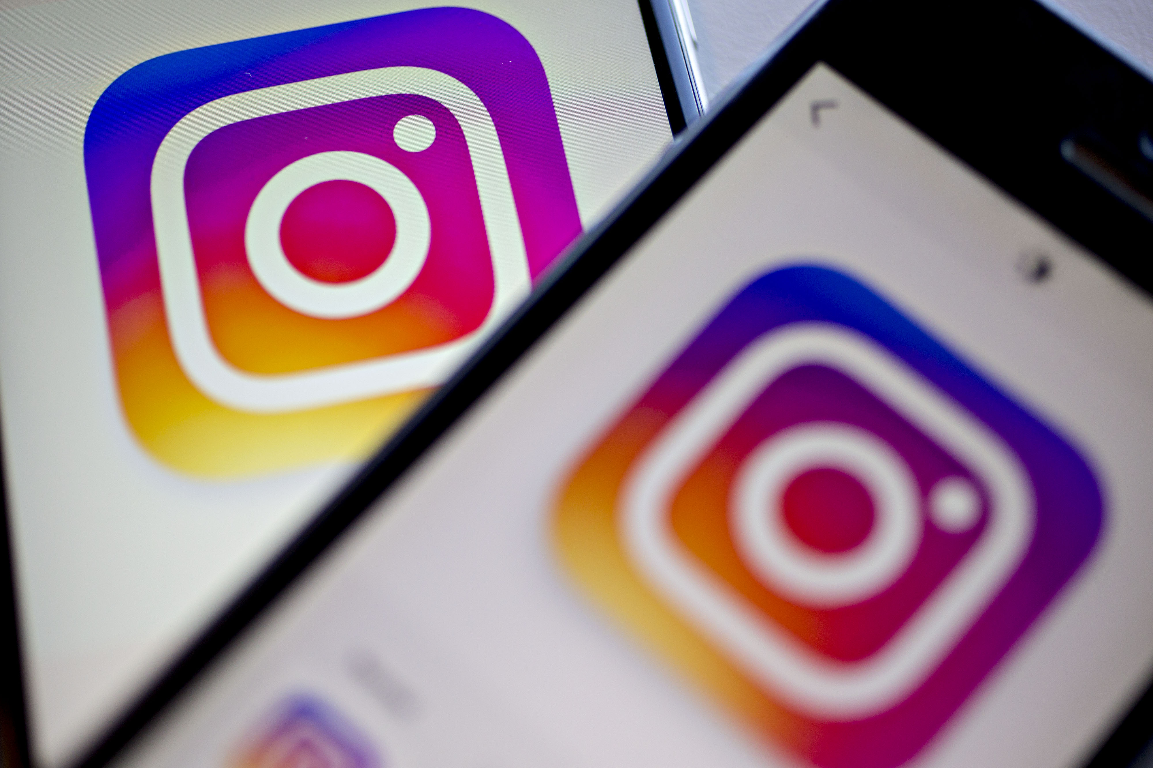 Facebook Inc.'s Instagram logo is displayed on the Instagram application on an Apple Inc. iPhone in this arranged photograph taken in Washington, D.C., U.S., on June 17. (Bloomberg&mdash;Bloomberg via Getty Images)