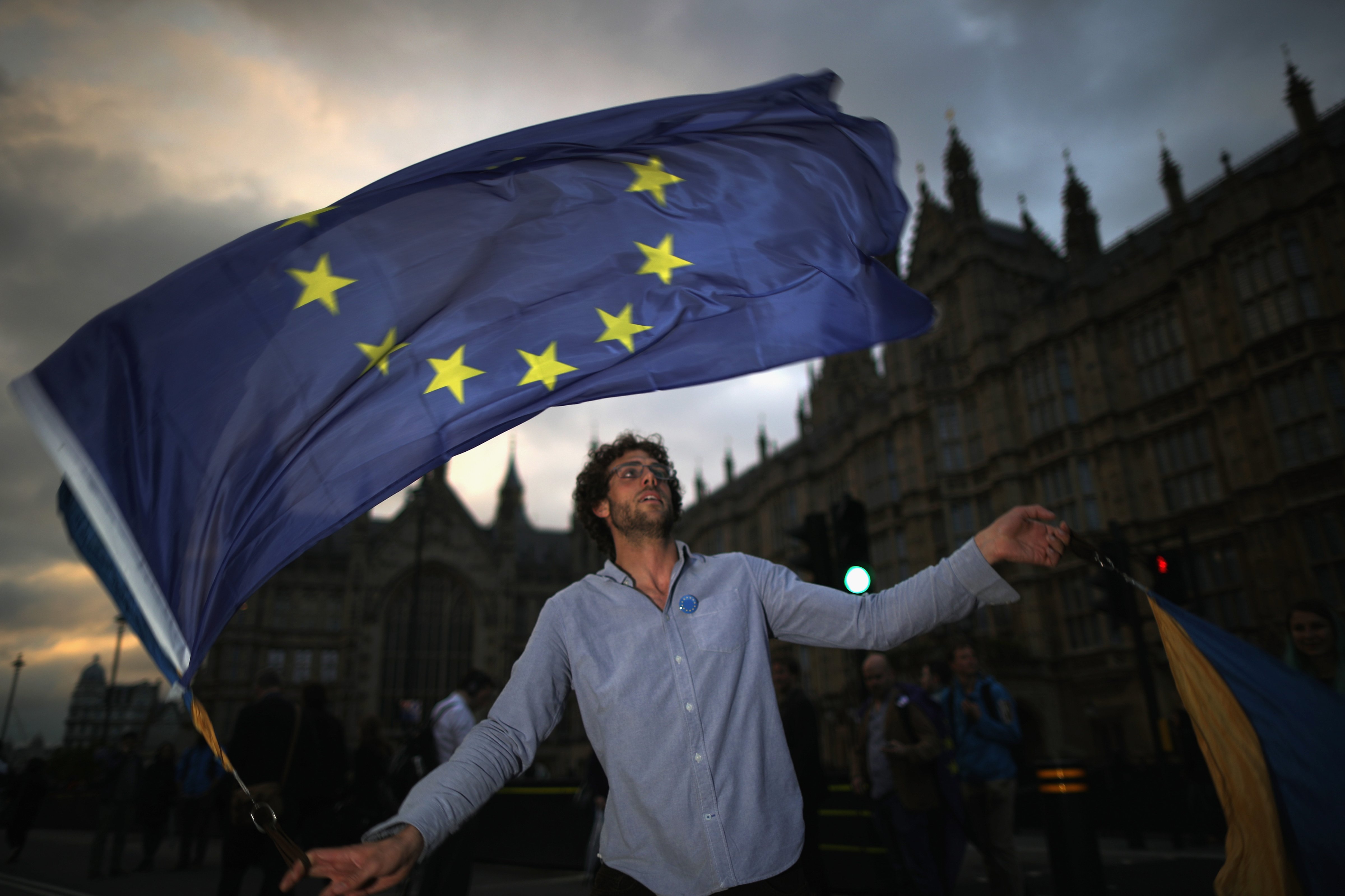 A protester waves an EU flag in front of the Houses of Parliament as they demonstrate against the EU referendum result on June 28, 2016 in London, England (Christopher Furlong—Getty Images)