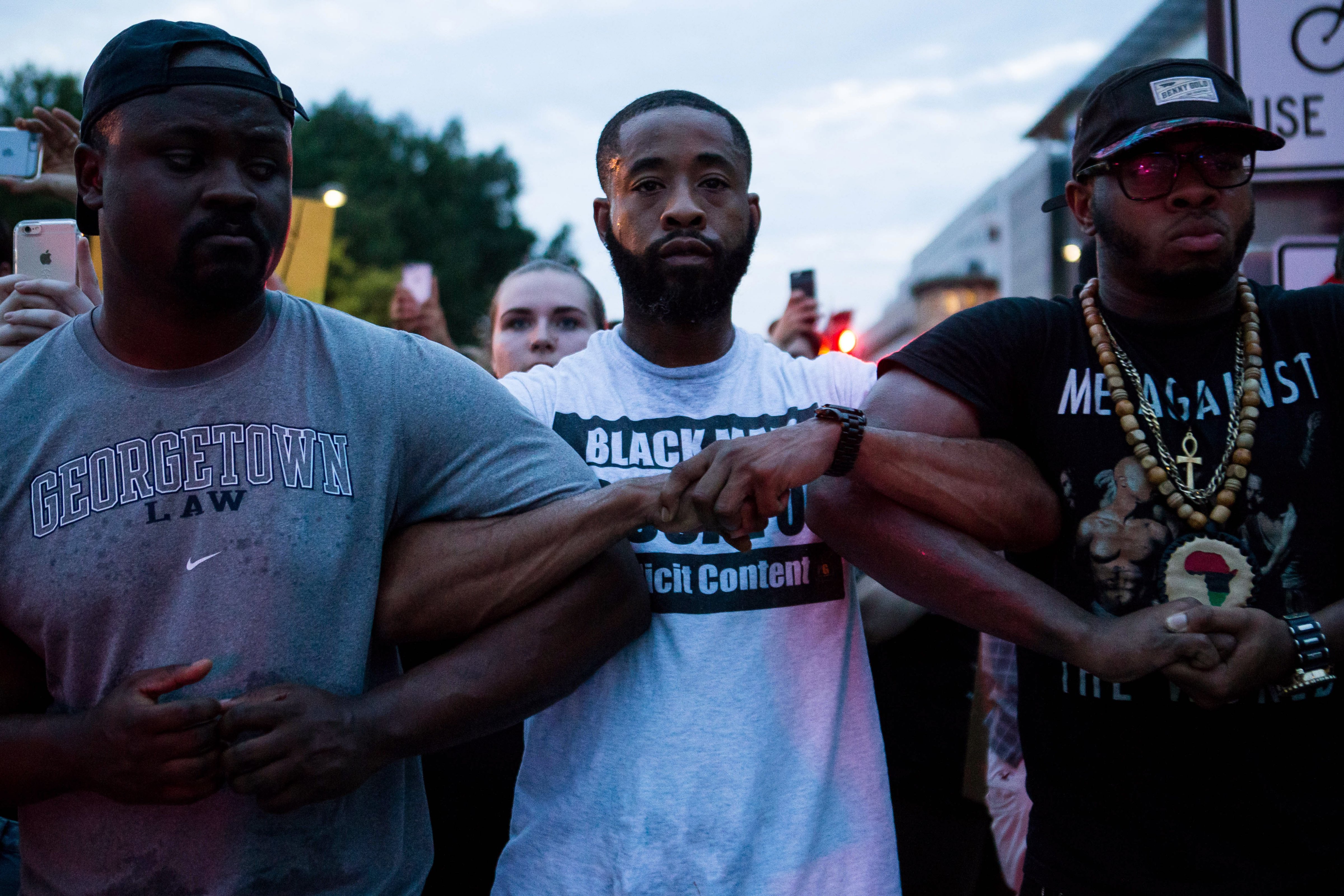 Demonstrators lock arms as they march from The White House on July 7, 2016, to protest the fatal police shootings of Alton Sterling and Philando Castile. (Zach Gibson&mdash;Getty Images)