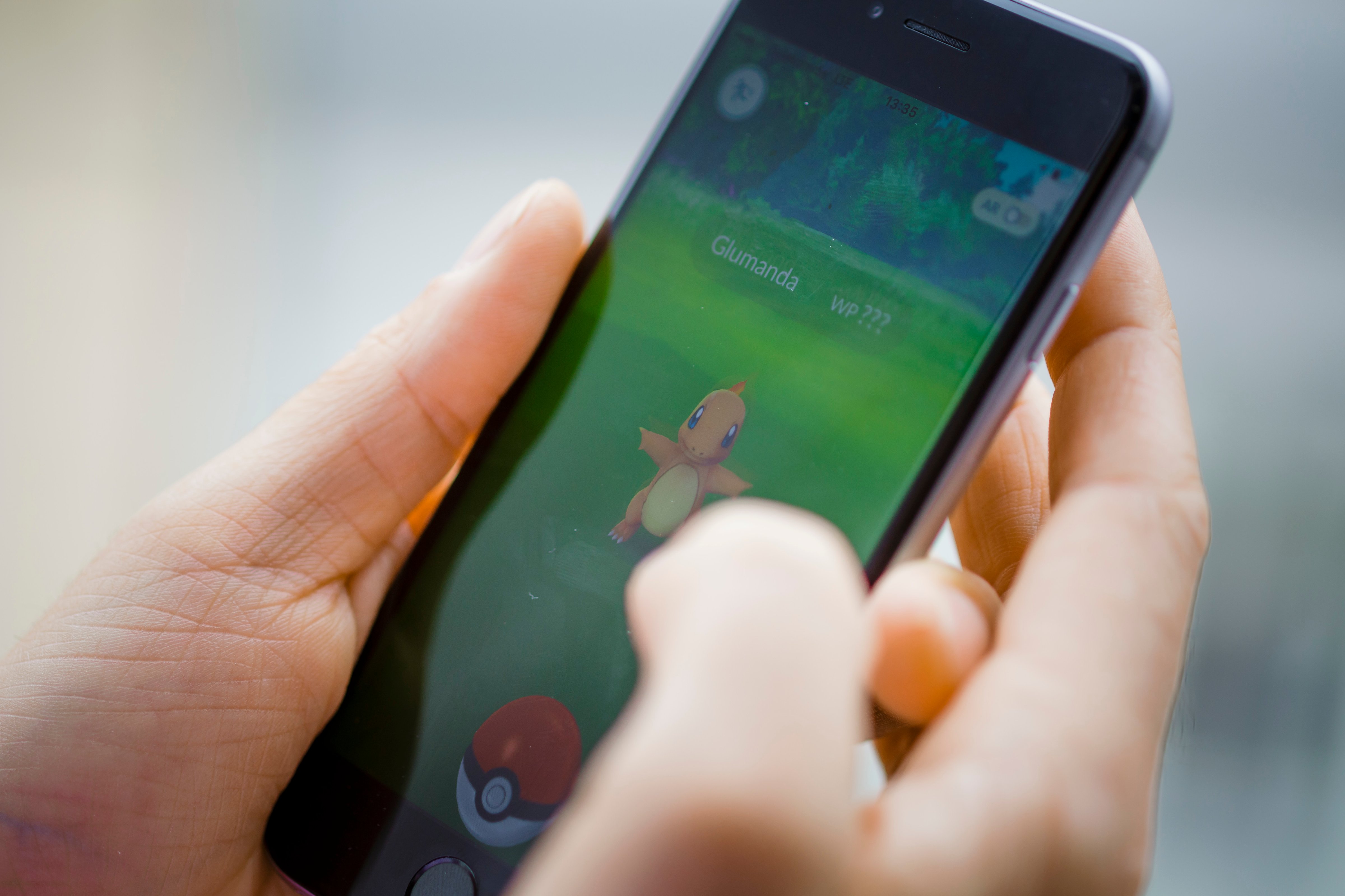 A Pokemon Go user plays the game on his smartphone on July 14, 2016. (Thomas Trutschel—Photothek/Getty Images)