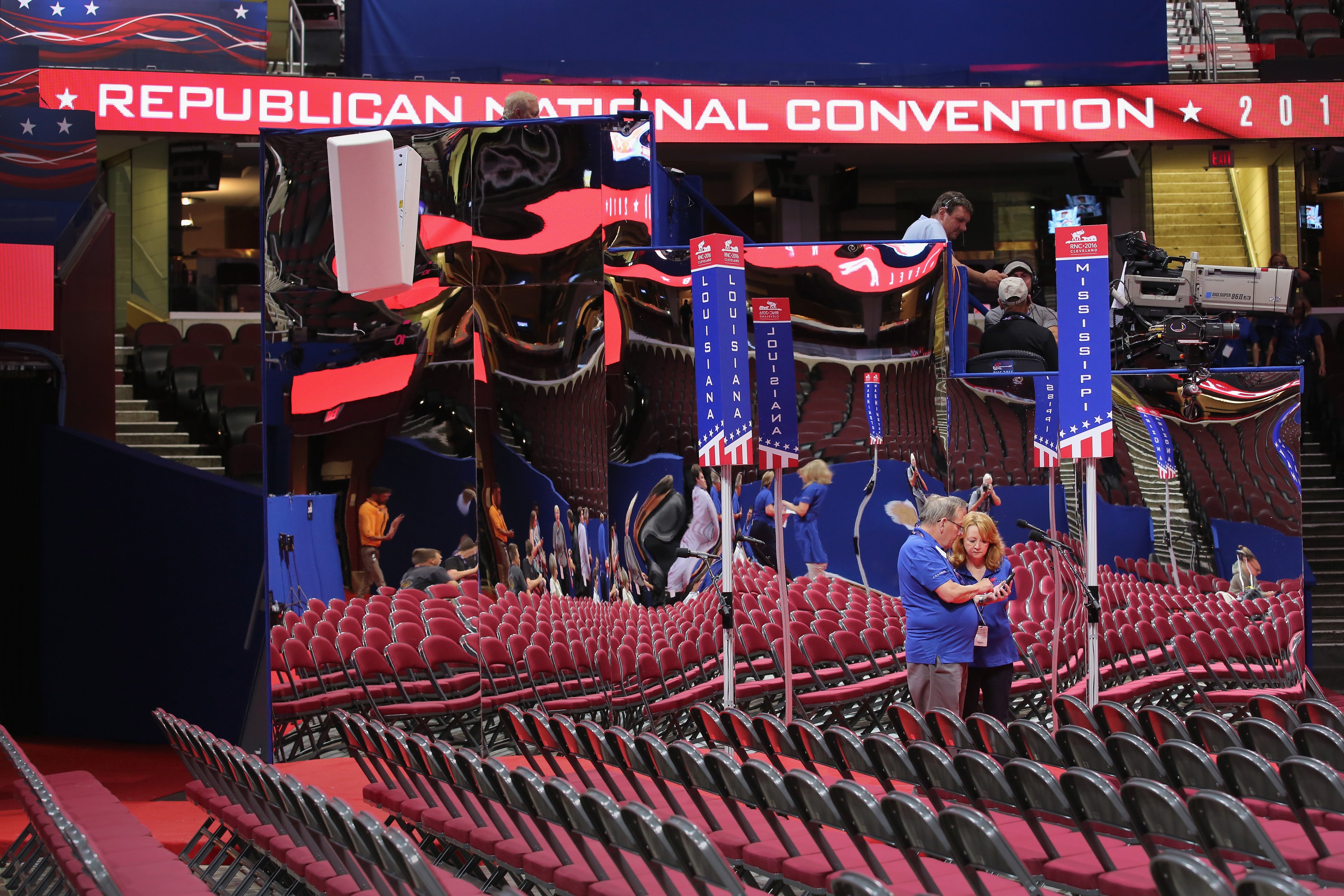 vent workers compare photos on the floor of the Quicken Loans Arena ahead of the Republican National Convention on July 16, 2016 in Cleveland, Ohio. (John Moore—Getty Images)