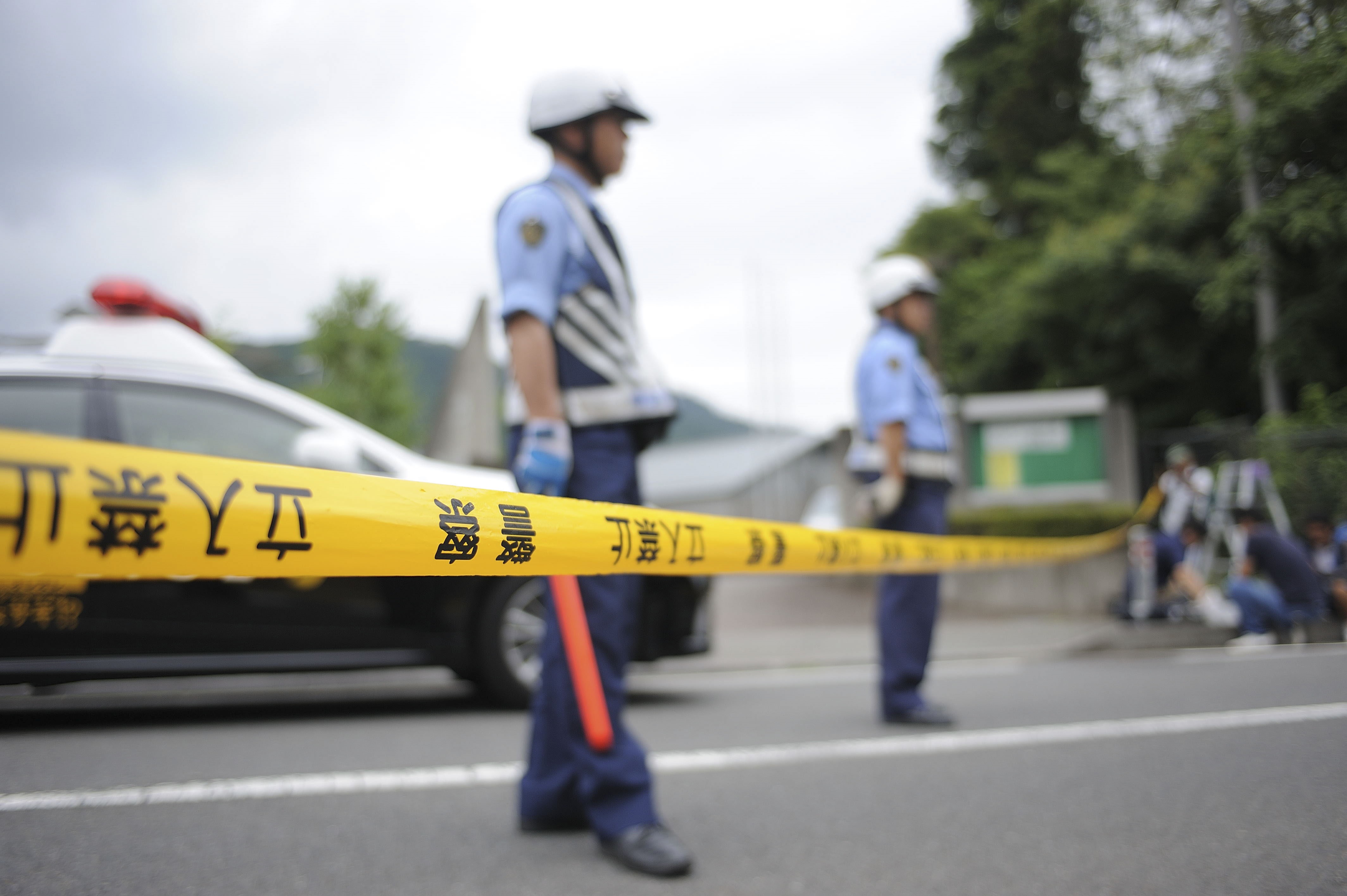 Police are seen on the site where Satoshi Uematsu carried out a knife attack in a residential care center on July 26, 2016, in Sagimahara city, Kanagawa Prefecture, Tokyo, Japan. (David Mareuil—Anadolu Agency/Getty Images)