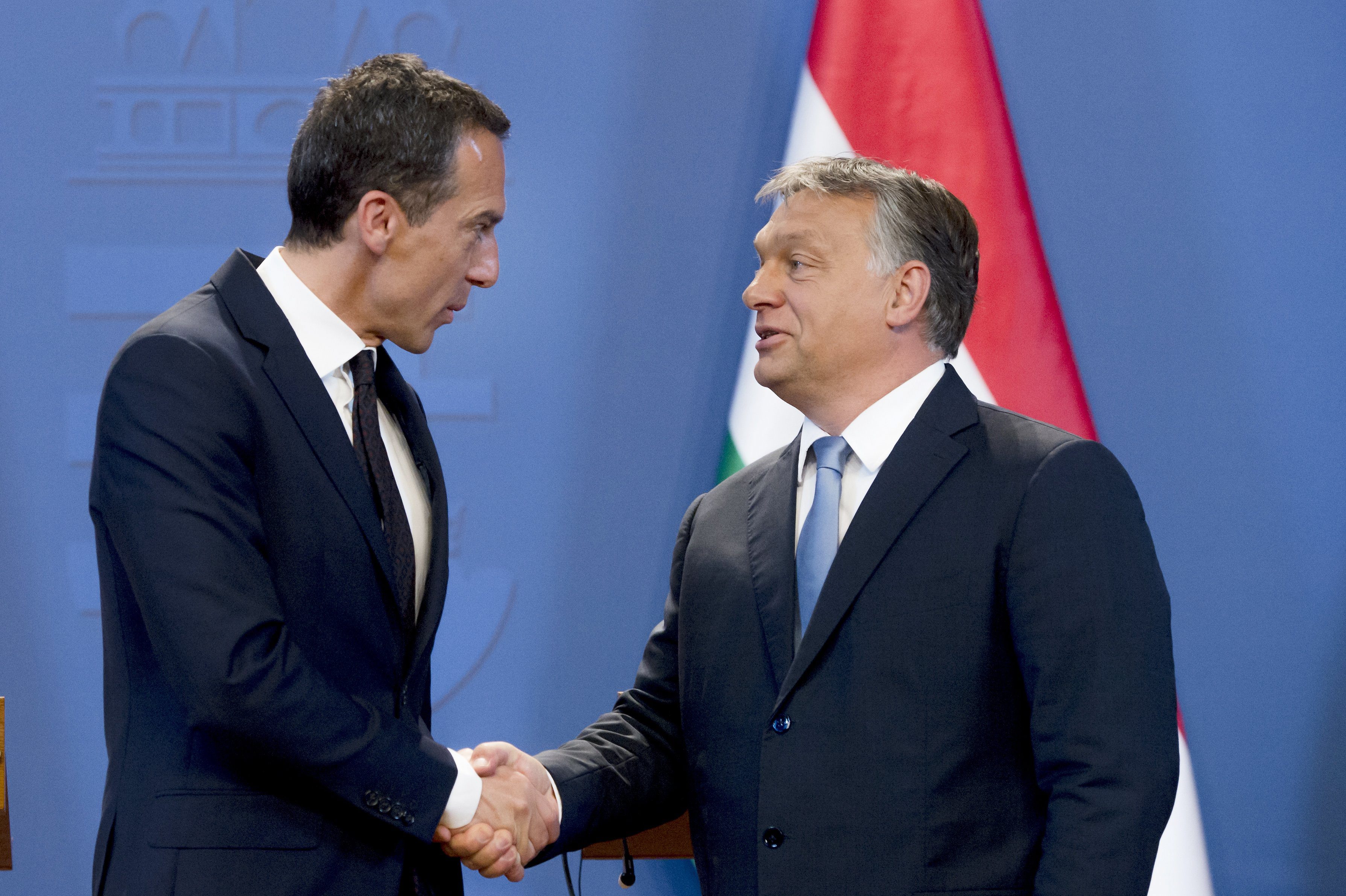 Austrian Federal Chancellor Christian Kern (L) and Hungarian Prime Minister Viktor Orban (R) shake hands after their joint press conference at the Delegation Room of the Parliament in Budapest, Hungary on July 26 2016 (Szilard Koszticsak—EPA)