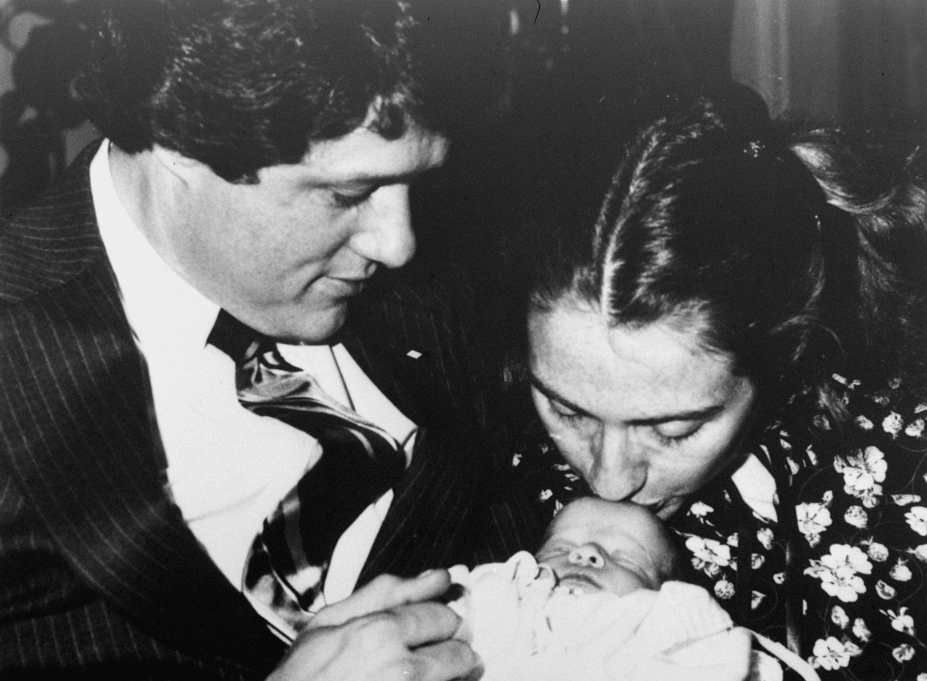 Arkansas Gov. Bill Clinton and wife Hillary Rodham hold their week-old baby Chelsea on March 5, 1980.