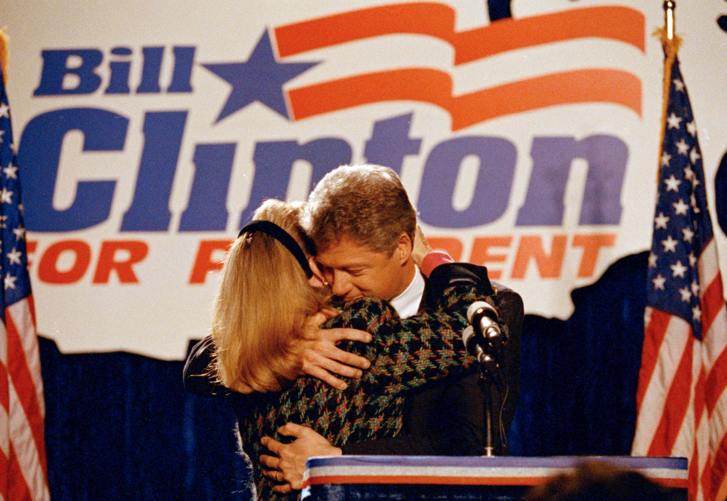 Democratic presidential candidate Bill Clinton hugs his wife Hillary Clinton after she introduced him to well wishers at a downtown Chicago hotel, March 10, 1992.