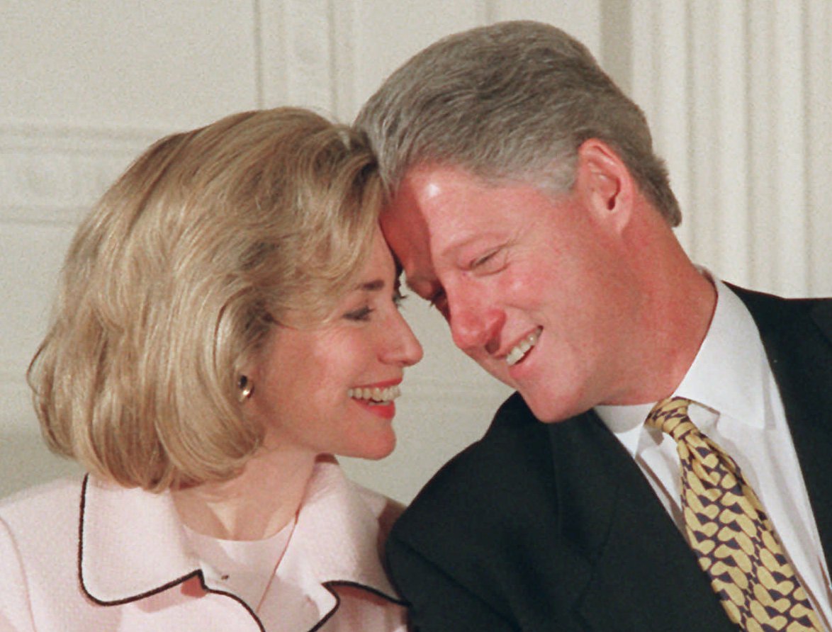 President Bill Clinton and First Lady Hillary Clinton share a moment during an East Room ceremony at the White House on July 17, 1996.