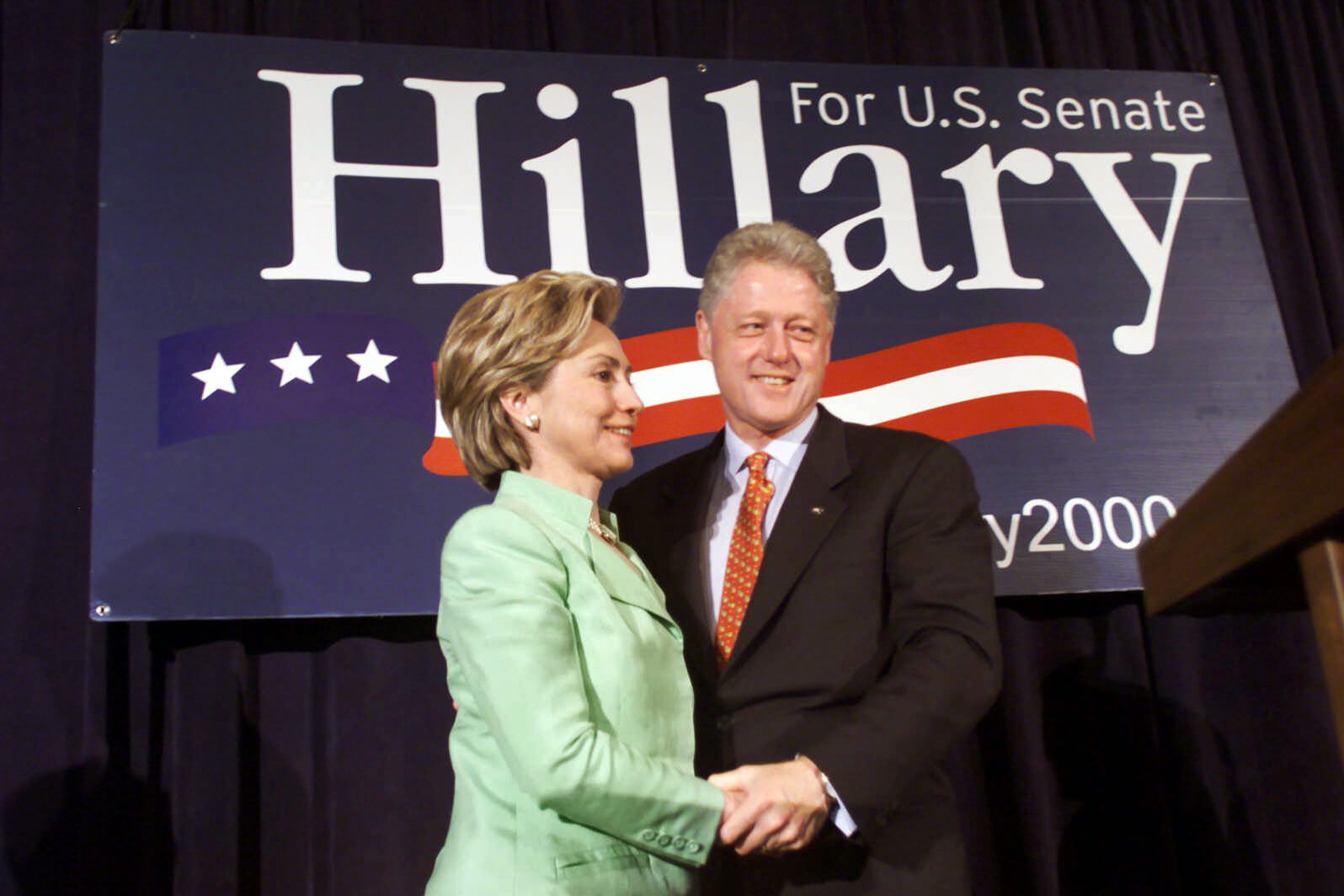 President Bill Clinton and First Lady Hillary Rodham Clinton embrace during the New York State Senate luncheon on July 29, 2000 in New York City.