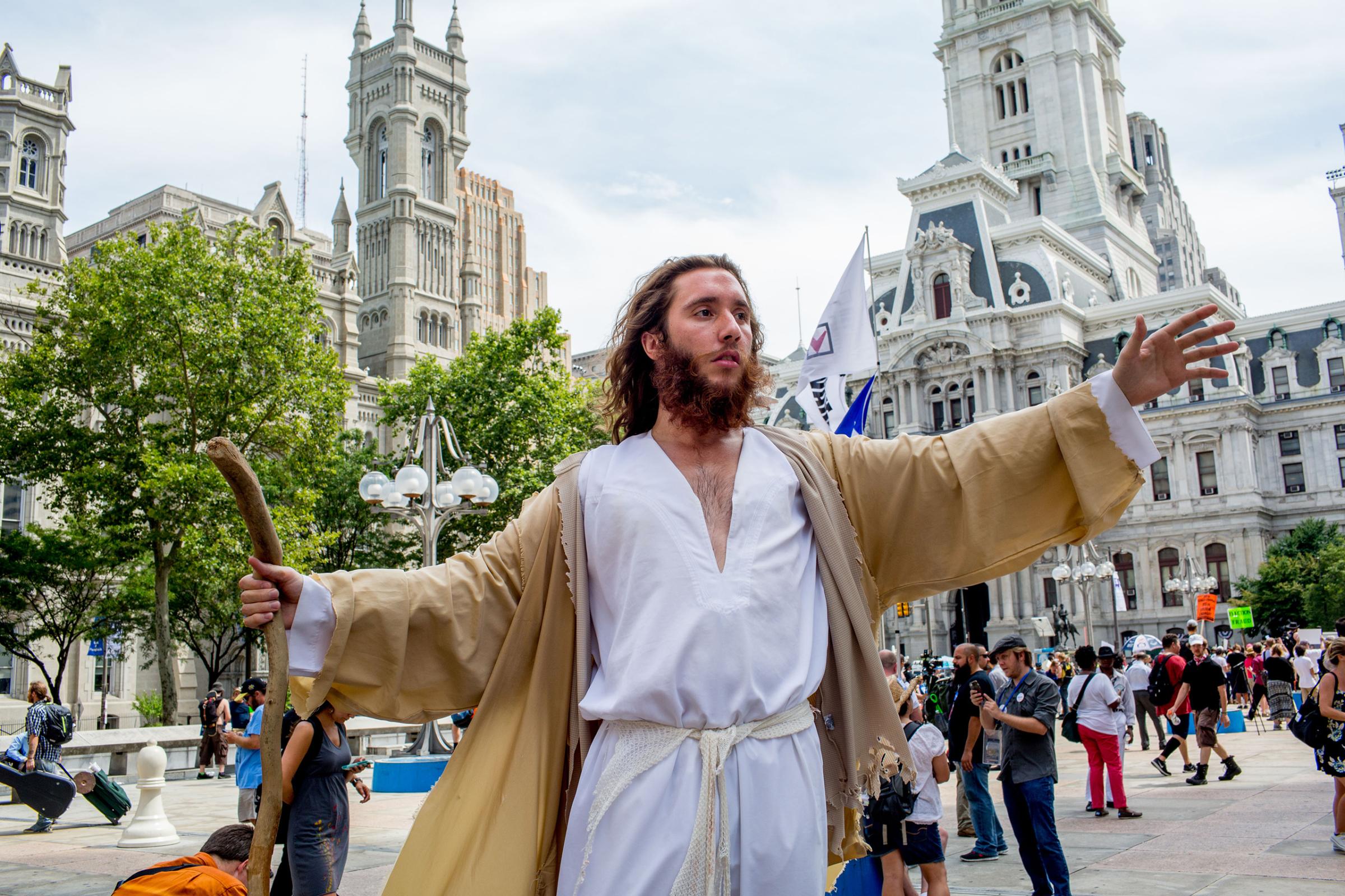 A protestor dressed like Jesus Christ near City Hall in Philadelphia on Tuesday afternoon to protest the Democratic National Convention at the Wells Fargo Center on July 26, 2016.