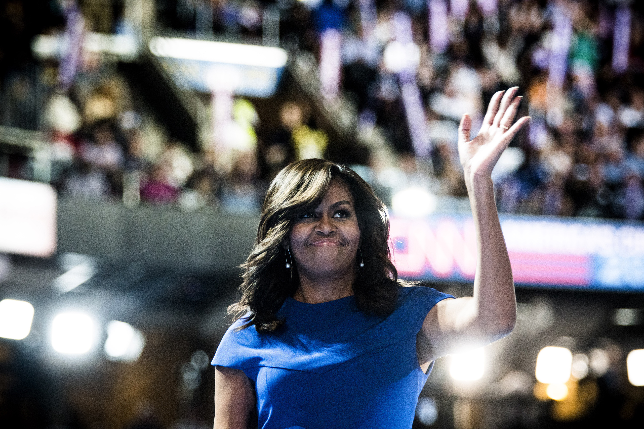 First lady Michelle Obama waves to the crowd before delivering remarks on the first day of the Democratic National Convention at the Wells Fargo Center, July 25, 2016 in Philadelphia, Pennsylvania.