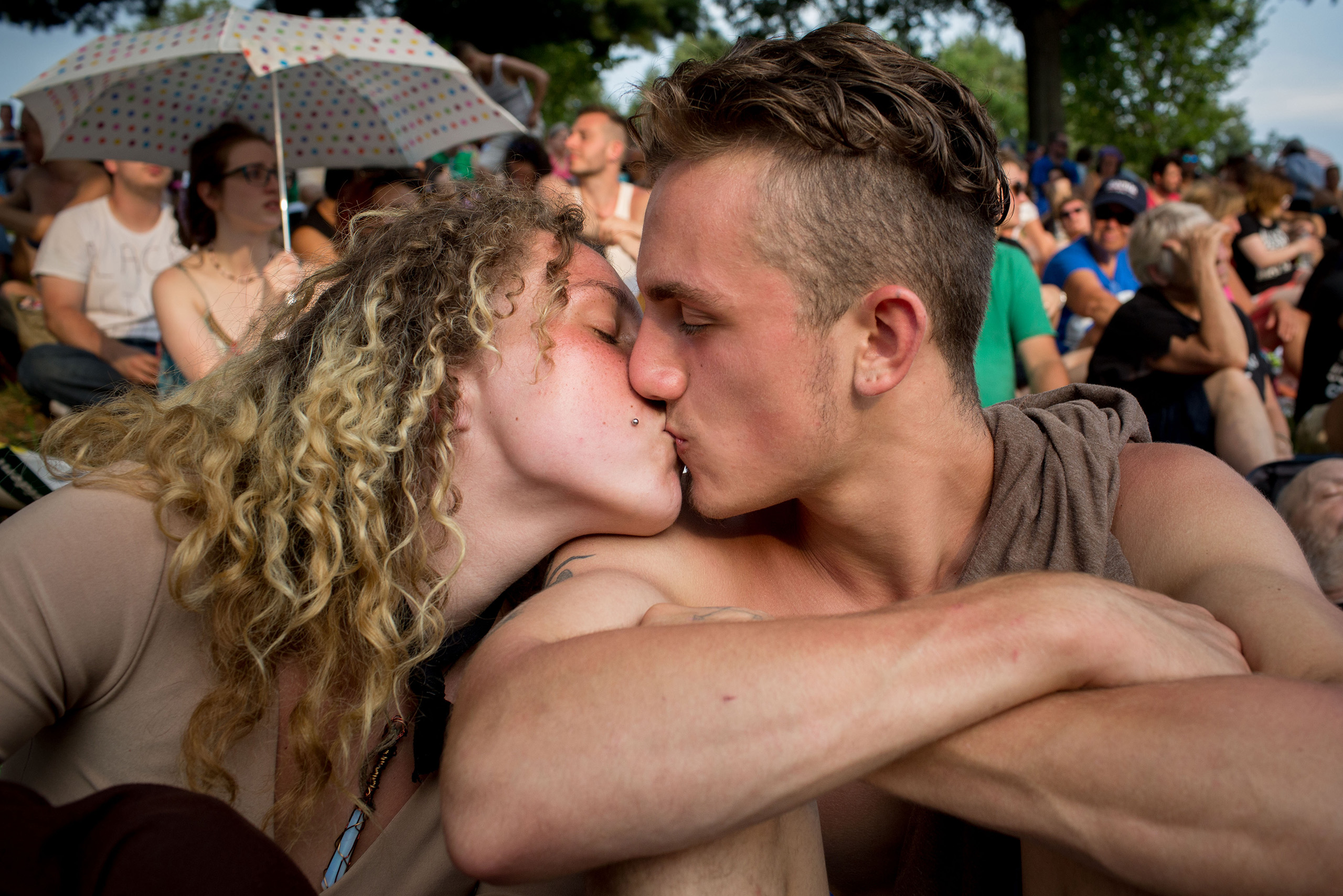 Deirdre Hilla and Jake Rubin kiss at the protest park. Protesters convened at Franklin Roosevelt Park outside the Democratic National Convention at the Wells Fargo Center on July 25, 2016 in Philadelphia, PA. At a tent pitched in the park, they were addressed by many speakers including Green Party Candidate Jill Stein.