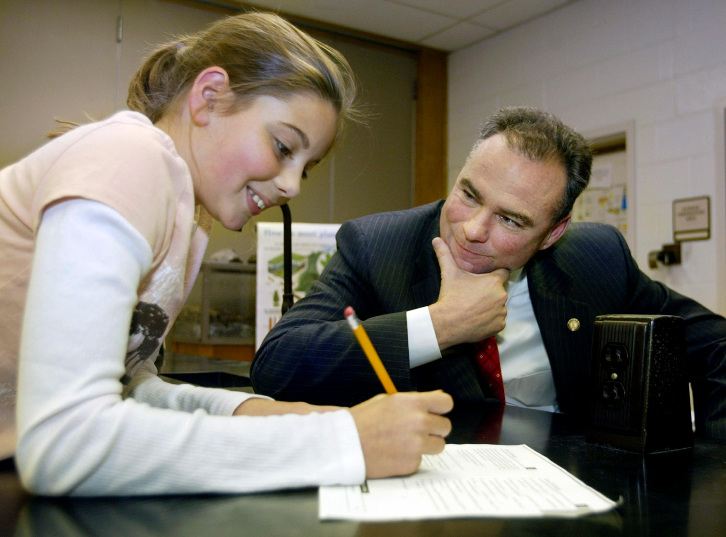 Virginia Gov. Tim Kaine and Aylor Middle School student Ryan Magalis, 11, left, work together on a word game in a gifted resource enlightment study hall at the school in Stephens City, Va. on Oct. 17, 2006.