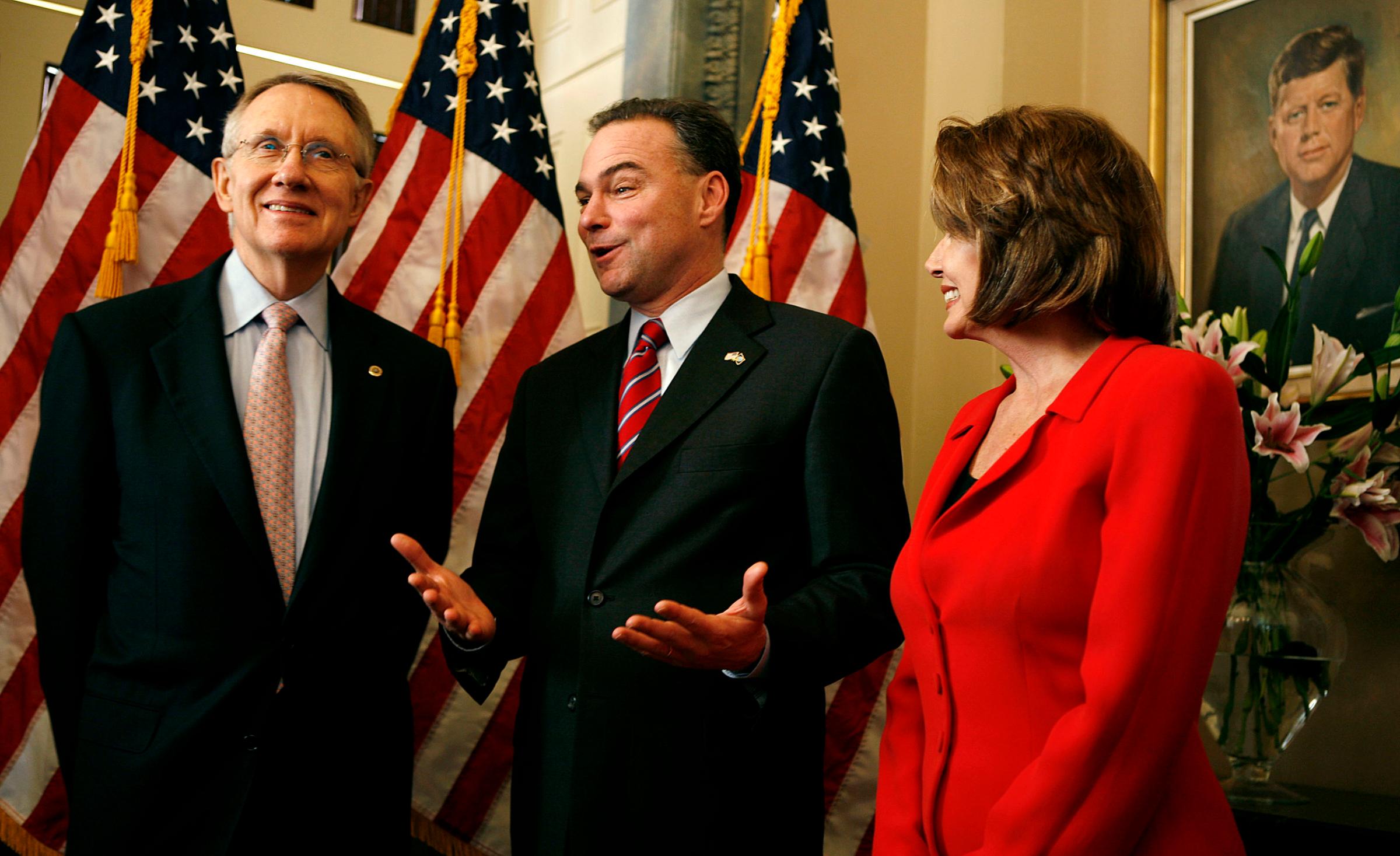 Senate Minority Leader Harry Reid left, Virginia Governor Tim Kaine center and House Minority Leader Nancy Pelosi pose for photographs on Capitol Hill in Washington on Jan. 31, 2006.