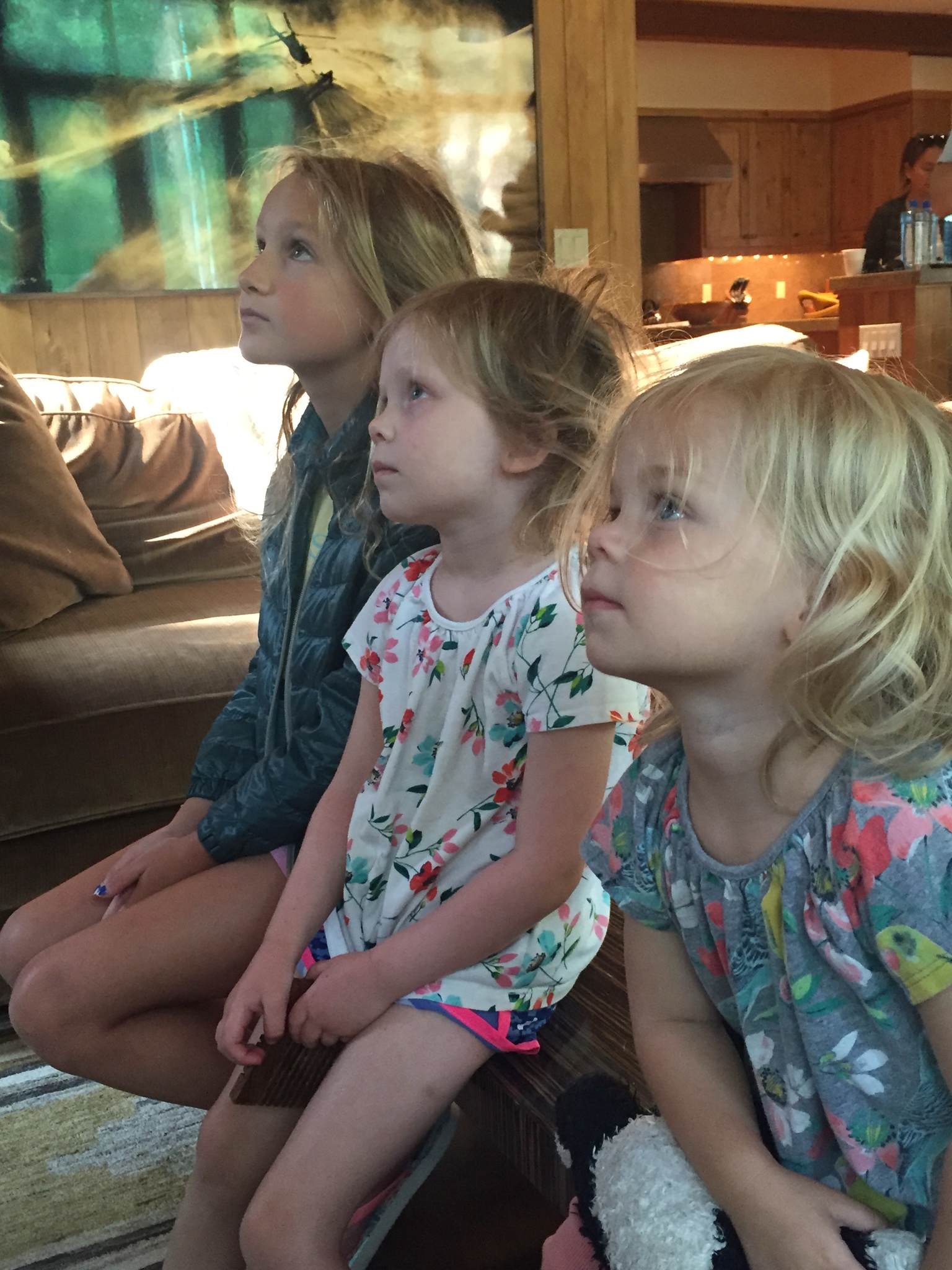 Three young girls watch Hillary Clinton accept the Democratic nomination.