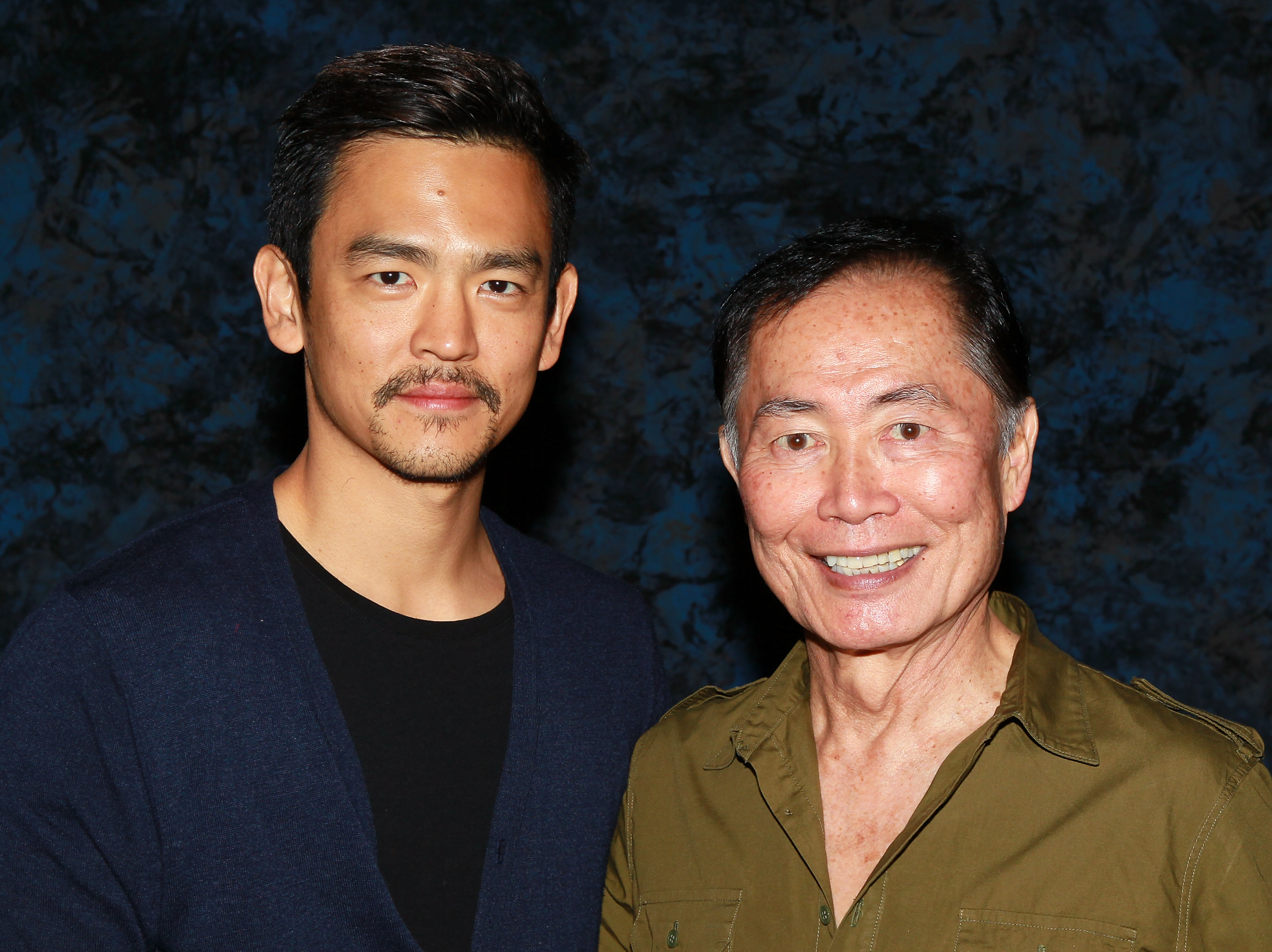 John Cho (L) and George Takei attend the Official Star Trek Convention on August 14, 2011 in Las Vegas, Nevada.