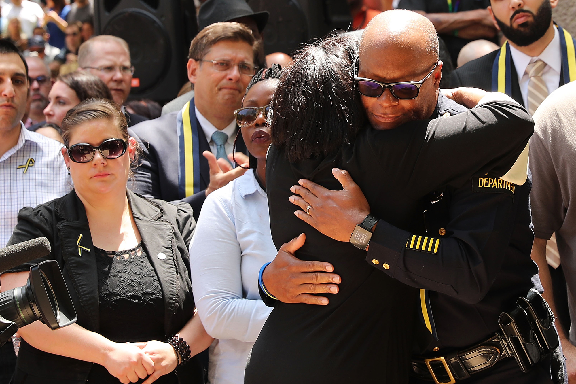 Dallas Police Chief David Brown is greeted with a hug at a prayer vigil following the deaths of five police officers in Dallas on July 8, 2016.