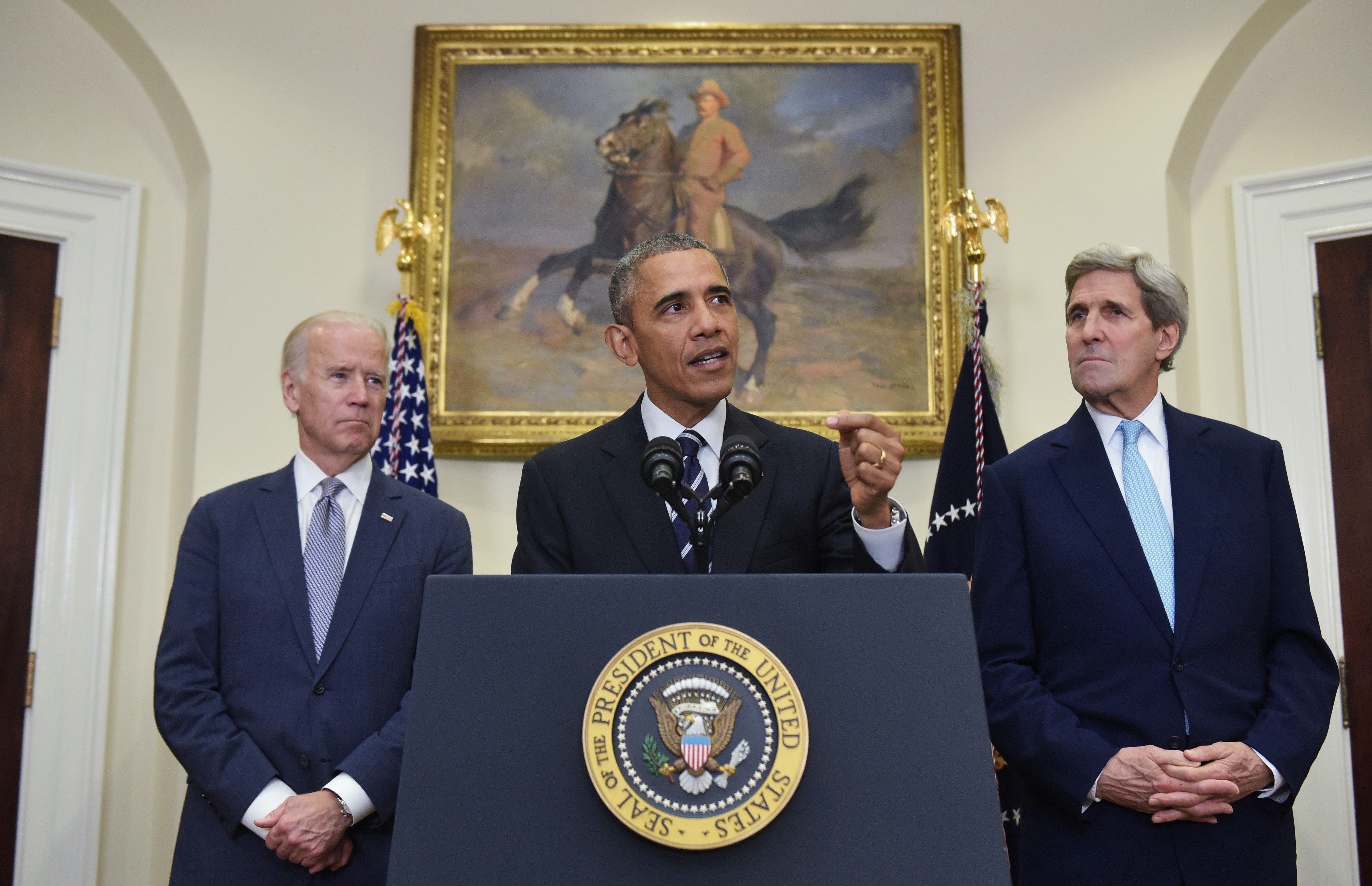 US President Barack Obama speaks on the Keystone XL pipeline, flanked by Secretary of State John Kerry (R), and Vice President Joe Biden, on Nov. 6, 2015 at the White House President Obama on Friday blocked the construction of a controversial Keystone XL oil pipeline. (Mandel Ngan—AFP/Getty Images)
