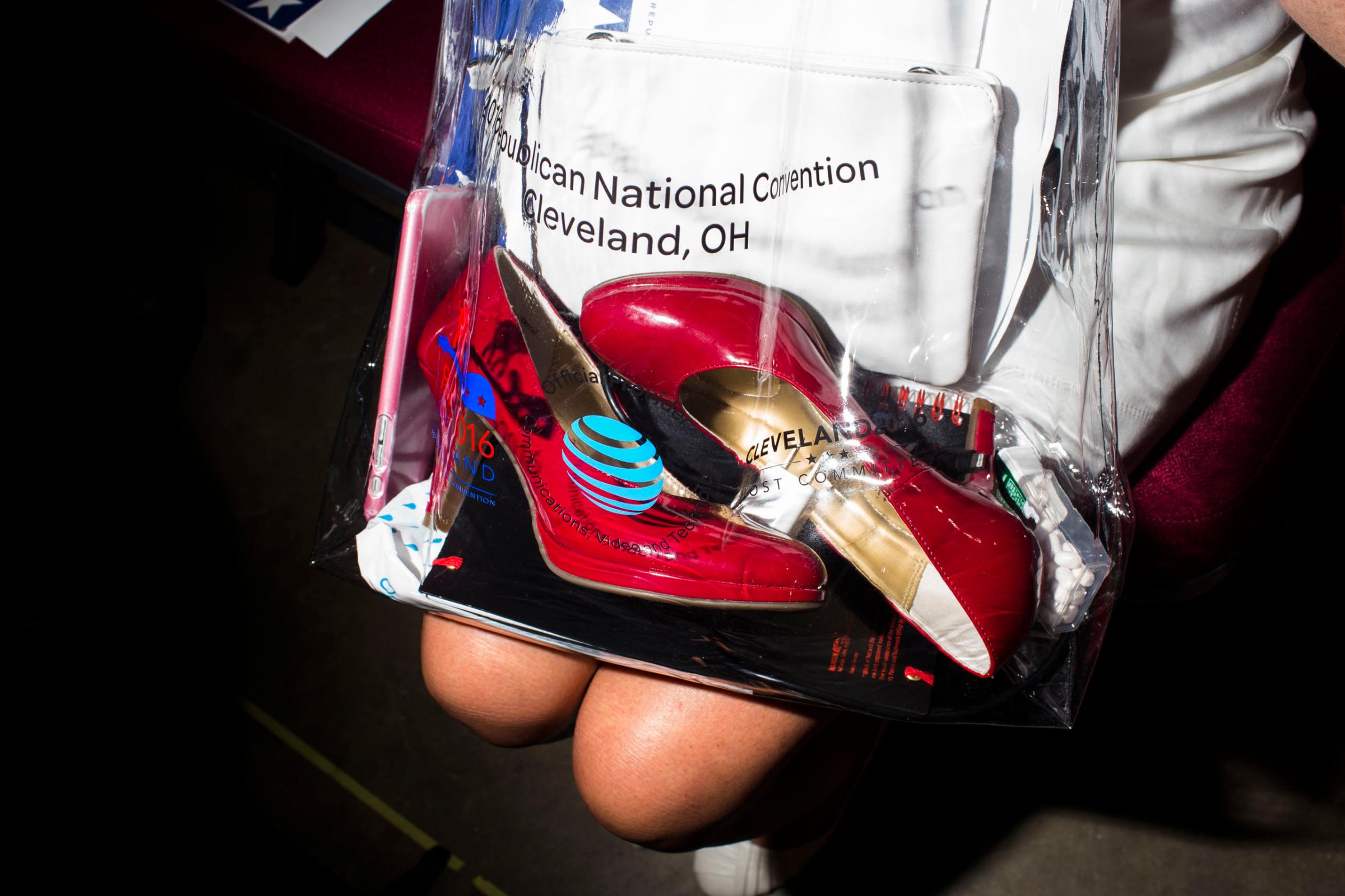 Red heels are carried on the floor of the 2016 Republican National Convention on Monday, July 18, 2016, in Cleveland.