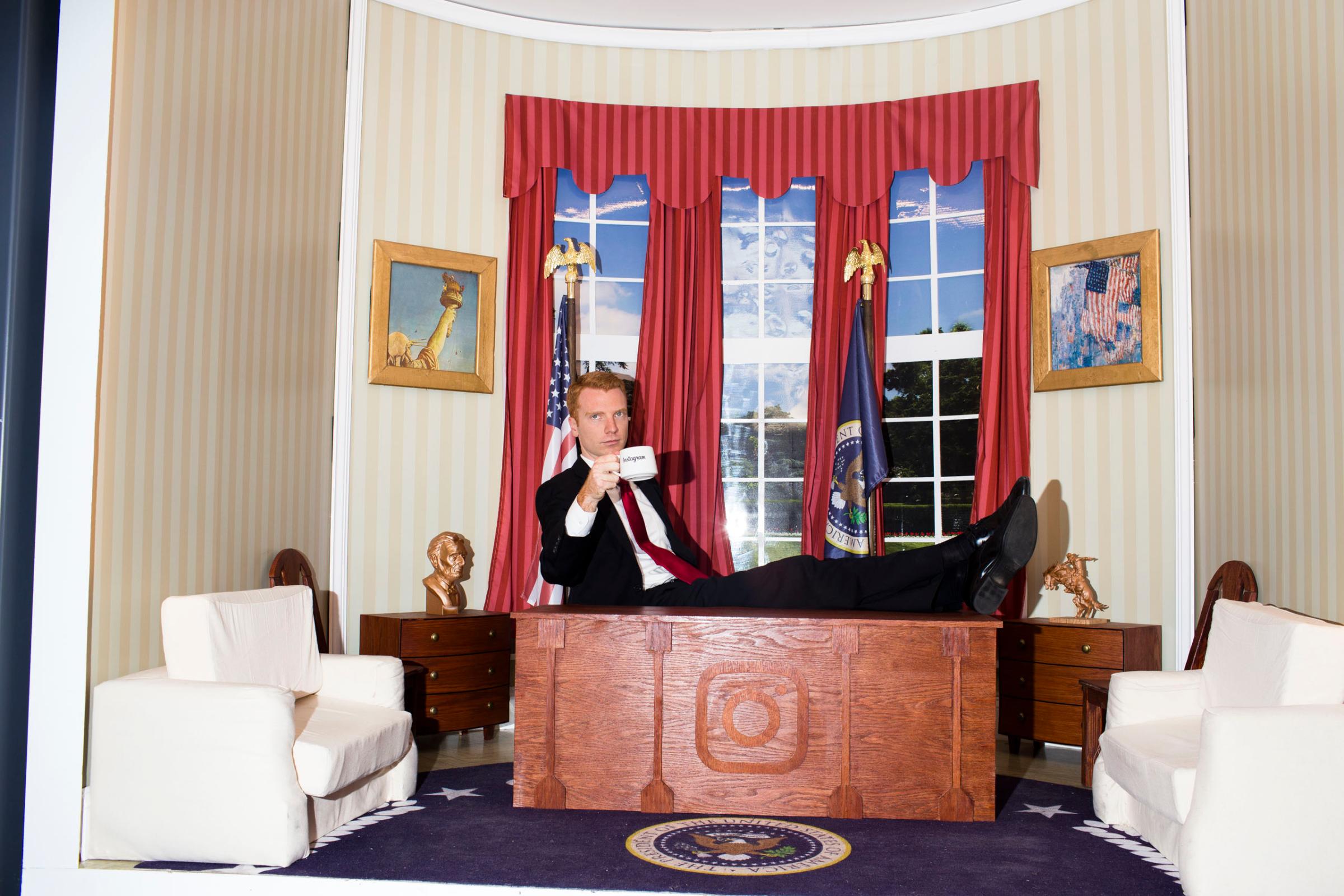 A man poses at Instagram's "Mini Oval" office at the 2016 Republican National Convention in Cleveland on Wednesday, July 20, 2016.