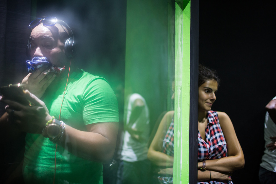 Reggaeton rapper Insurrecto records in a small studio in Centro Havana, he wipes his sweat with an American flag bandana on Sept. 21, 2015. Insurrecto, along with many of the genre's top artists, are able to fly abroad and perform in the U.S.