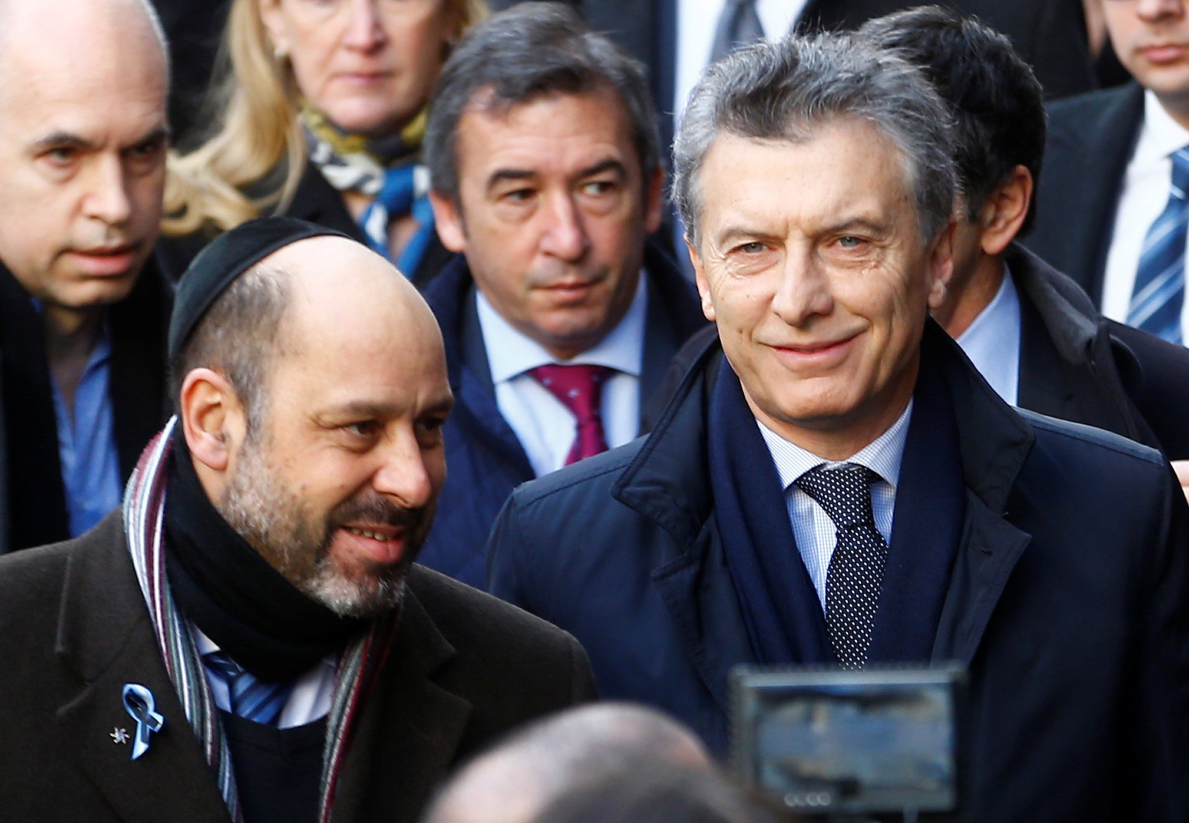 Argentine President Mauricio Macri accompanied by AMIA's Vice President Ralph Thomas Saieg arrives to attend a ceremony marking the 22nd anniversary of the 1994 attack that left 85 dead at the AMIA Jewish center in Buenos Aires, on July 18, 2016.