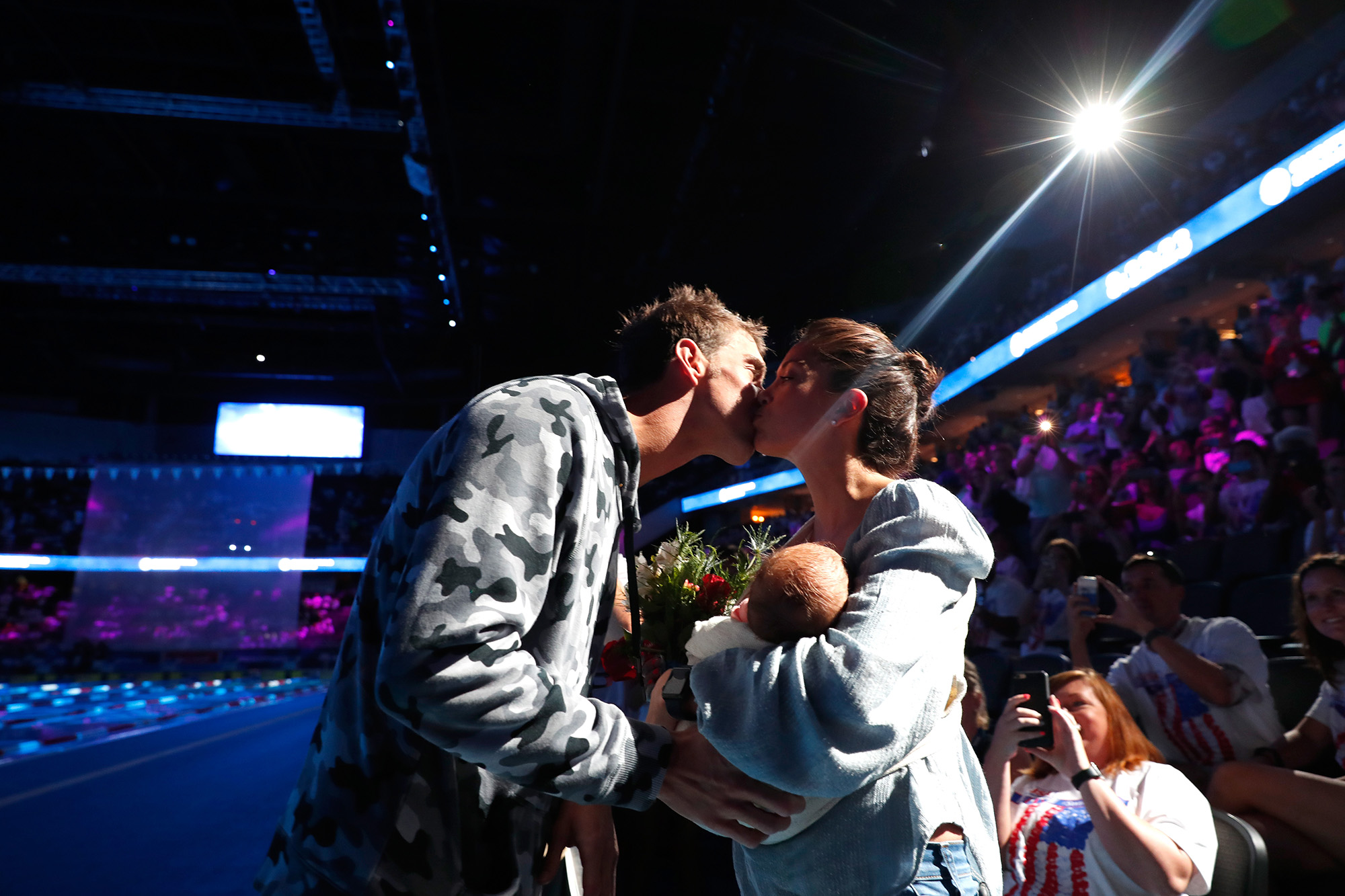 Michael Phelps of the United States celebrates with his fiancee Nicole Johnson and their son Boomer after finishing first in the final heat for the Men's 200 Meter Individual Medley during Day Six of the 2016 U.S. Olympic Team Swimming Trials at CenturyLink Center on July 1, 2016 in Omaha, Nebraska.  (Photo by Al Bello/Getty Images) (Al Bello&mdash;Getty Images)