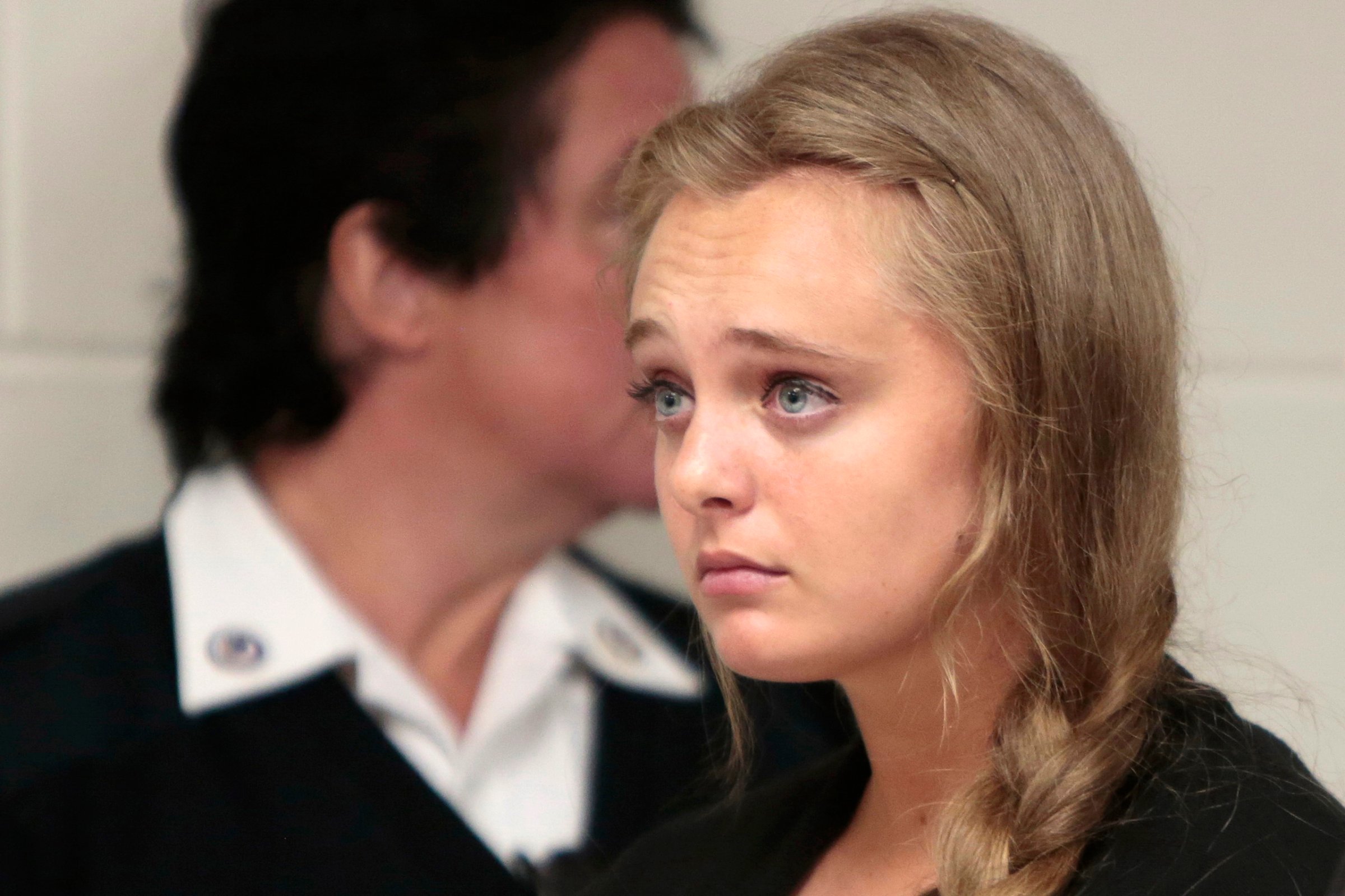 Michelle Carter listens to her defense attorney argue for an involuntary manslaughter charge against her to be dismissed at Juvenile Court in New Bedford, Mass. on Aug. 24, 2015.