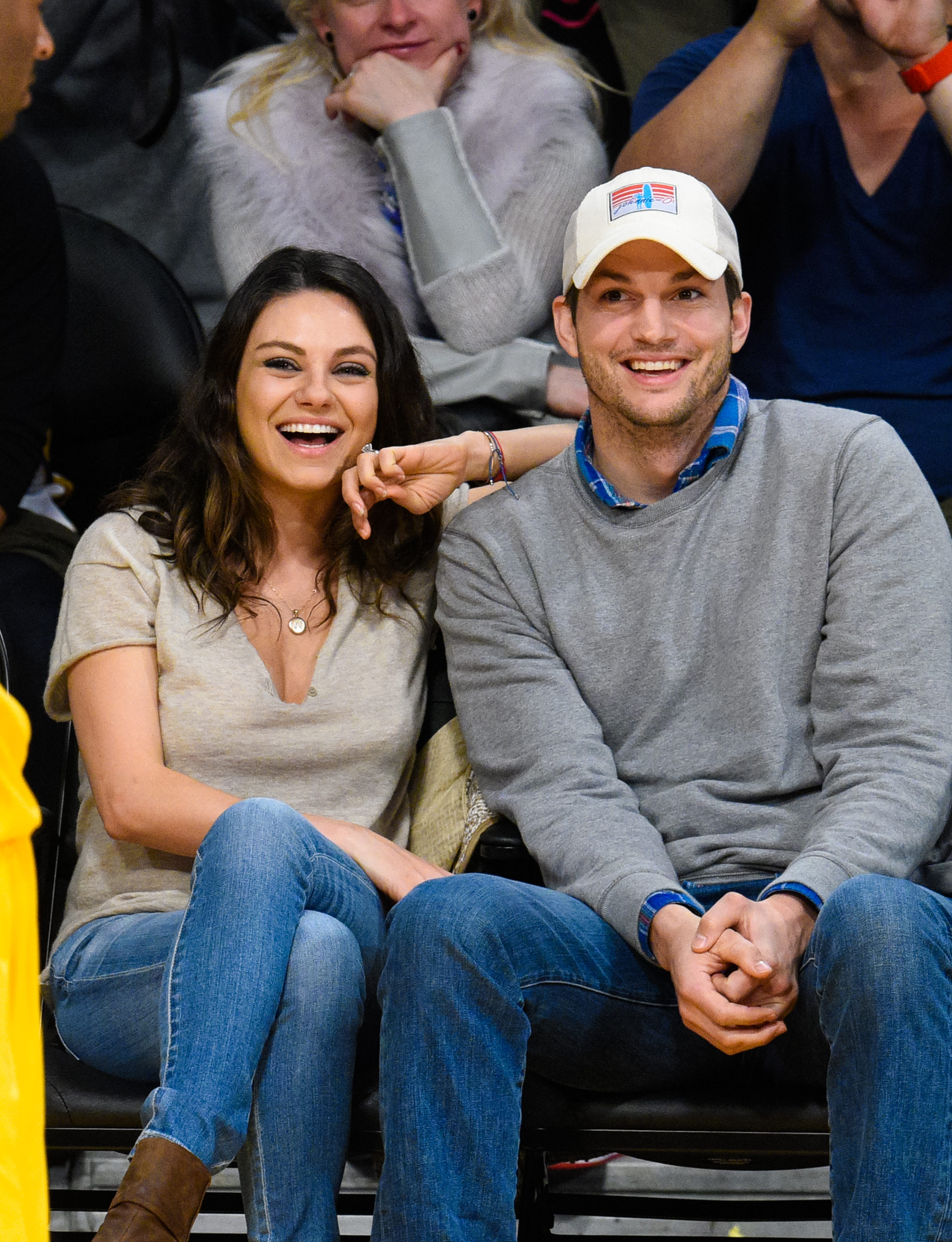 Mila Kunis (L) and Ashton Kutcher attend a basketball game between the Oklahoma City Thunder and the Los Angeles Lakers at Staples Center on December 19, 2014 in Los Angeles, California. (Noel Vasquez&mdash;GC Images/Getty Images)
