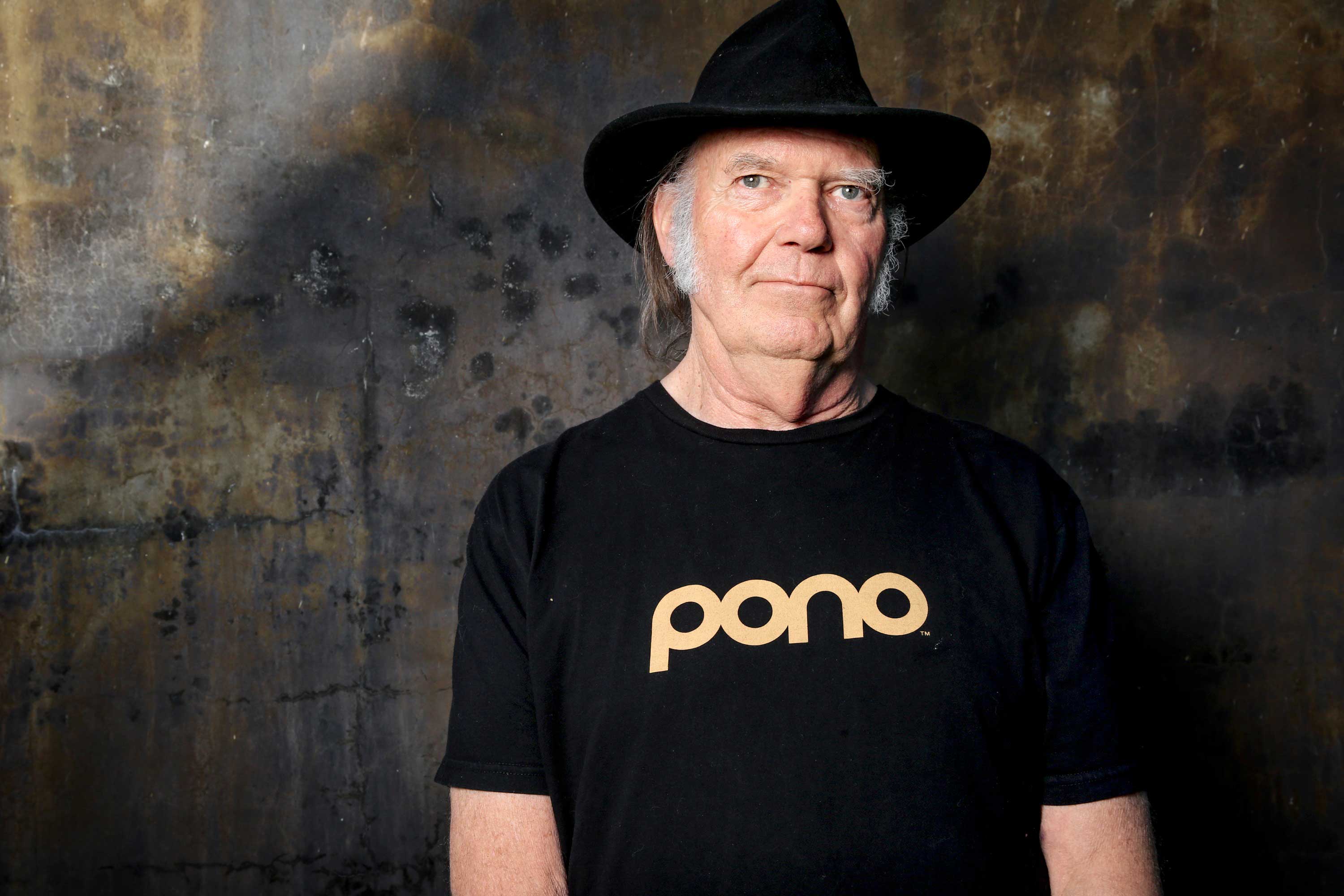 A bear stalks Neil Young’s new Earth (Rich Fury—Invision/AP)