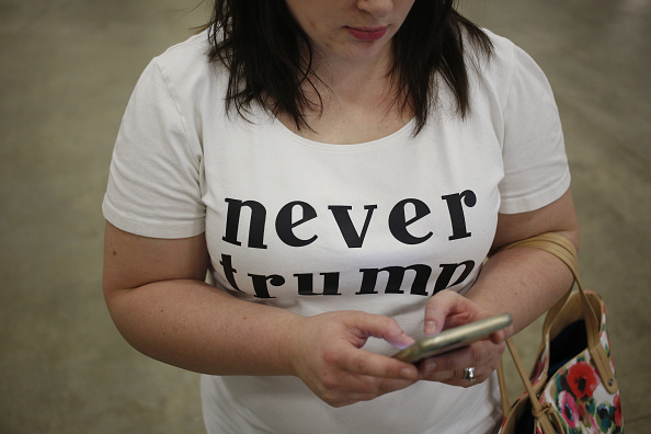 An attendee wears a "Never Trump" shirt during a campaign event for Donald Trump in Indianapolis, Indiana, April 20, 2016.
