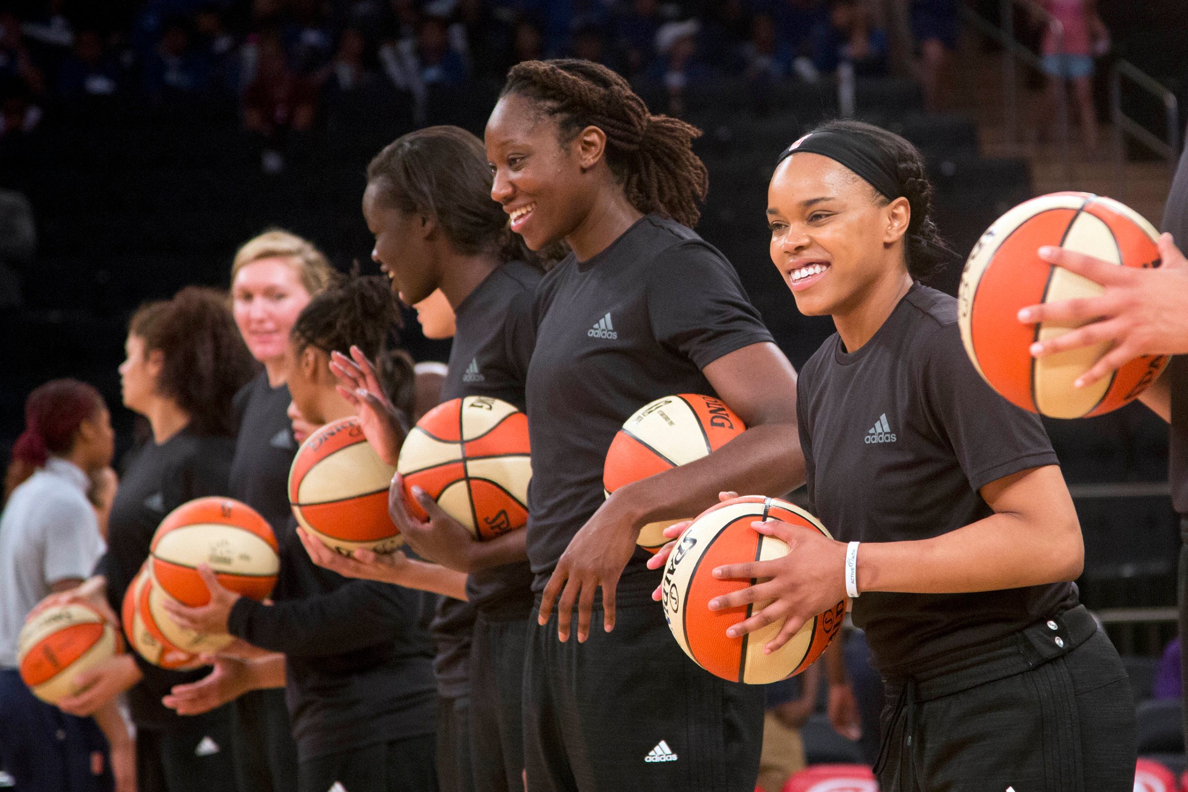 Members of the New York Liberty basketball team await the start of a game against the Atlanta Dream in New York City on July 13, 2016.