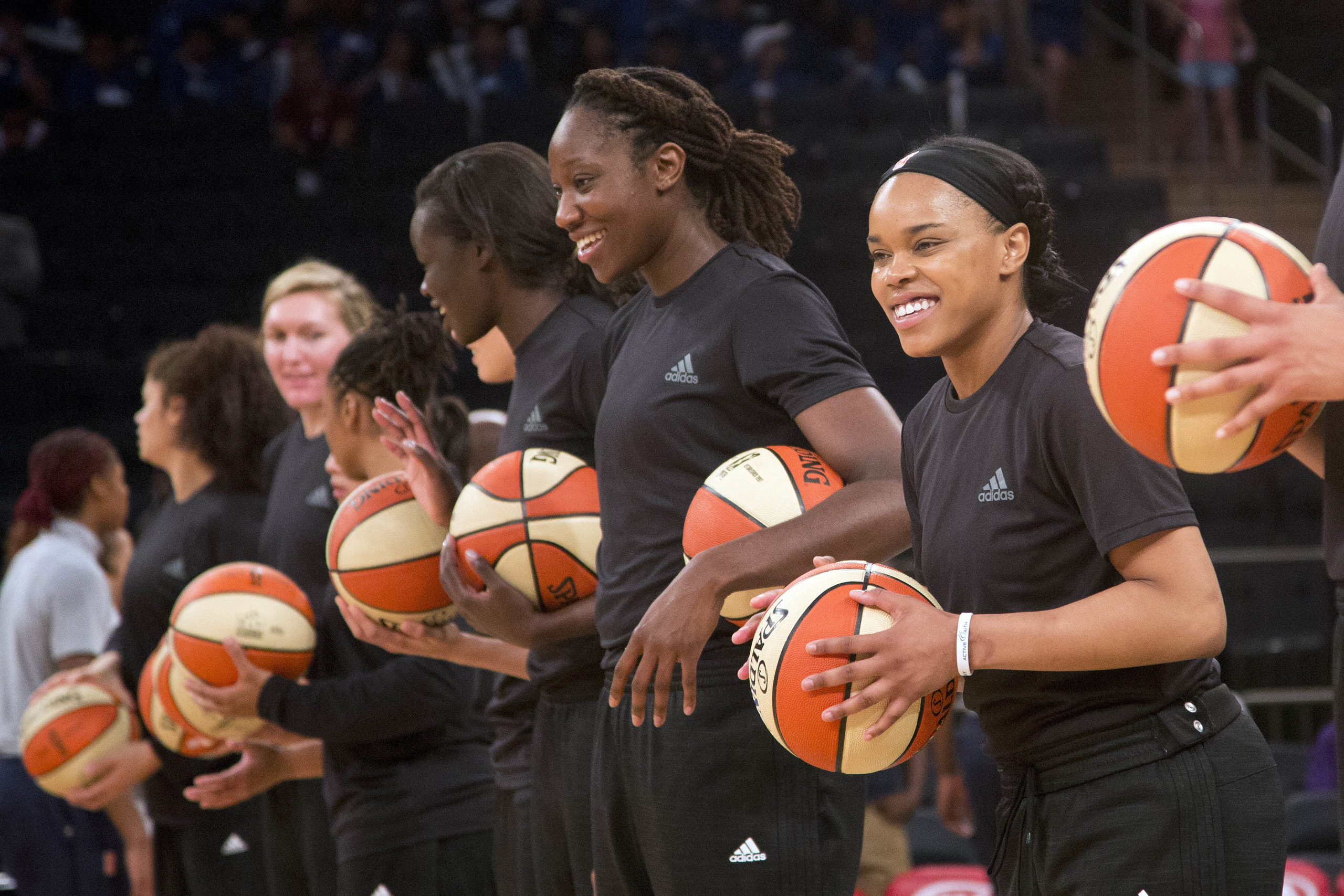 Members of the New York Liberty basketball team await the start of a game against the Atlanta Dream in New York City on July 13, 2016. (Mark Lennihan—AP)