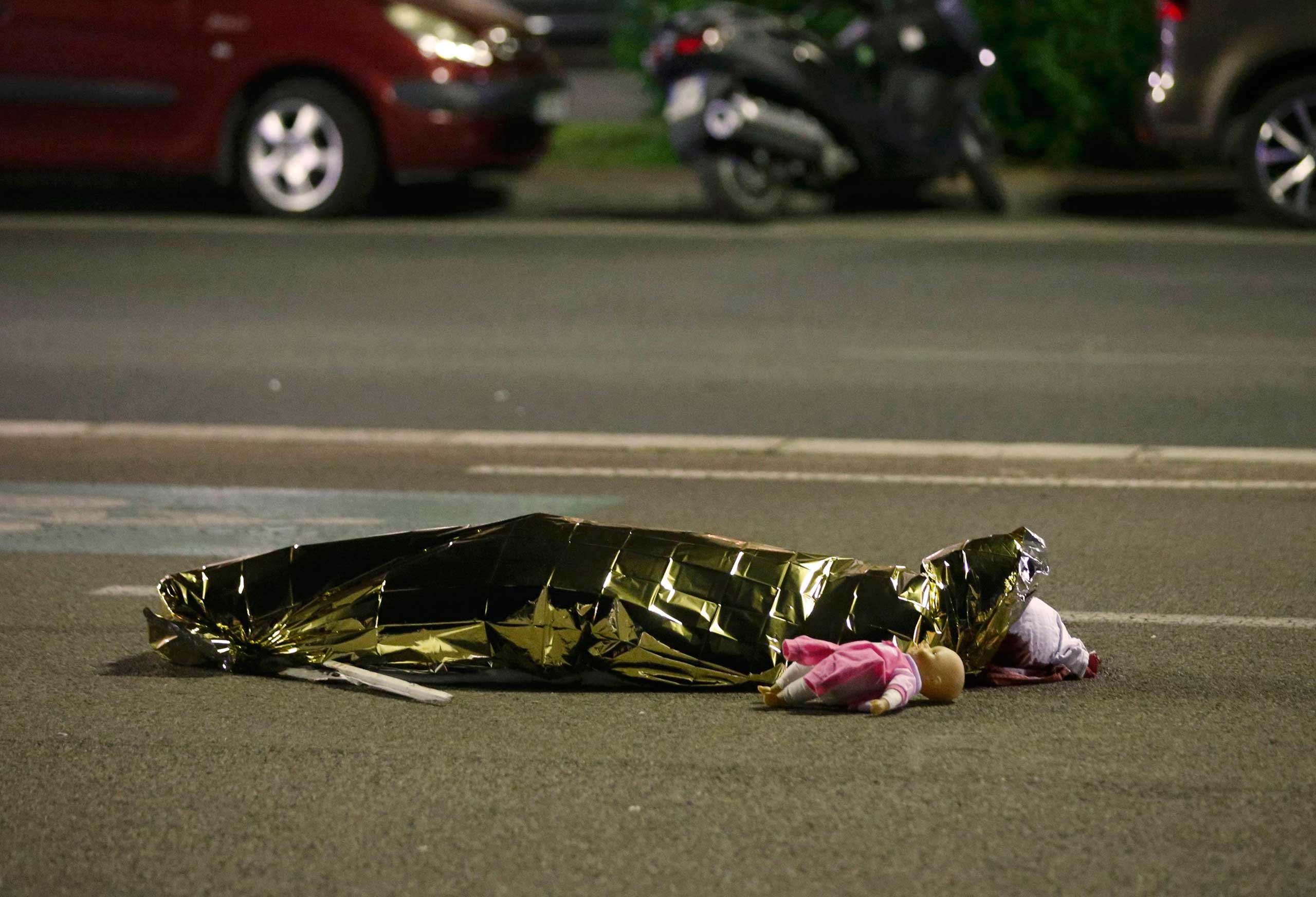 A body is seen on the ground July 15, 2016 after at least 84 people were killed in Nice, France, when a truck ran into a crowd celebrating the Bastille Day national holiday. (Eric Gaillard—Reuters)
