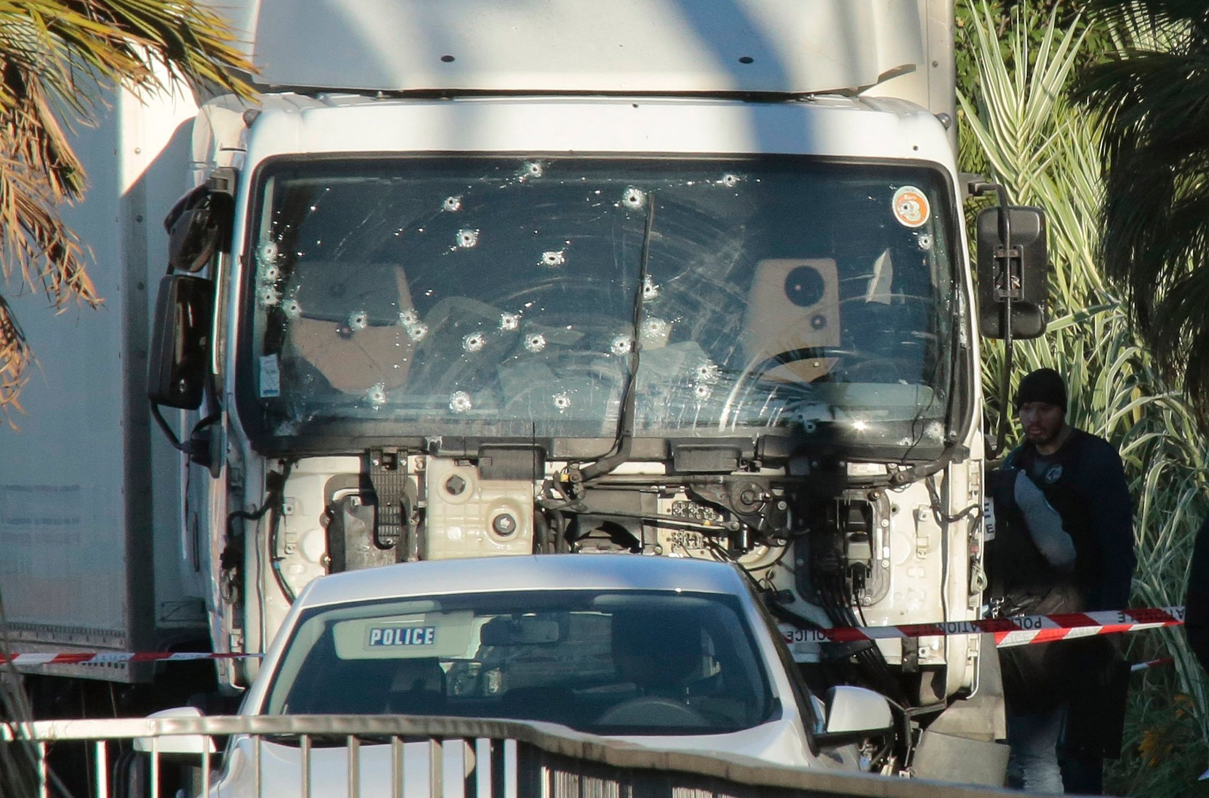 Forensic police investigate the truck at the scene of the terror attack on the Promenade des Anglais in Nice, France, on July 15, 2016. Authorities said a French-Tunisian attacker killed 84 people as he drove a truck through crowds, gathered to watch a firework display during Bastille Day celebrations. The attacker then opened fire on people in the crowd before being shot dead by police. Patrick Aventurier—Getty Images