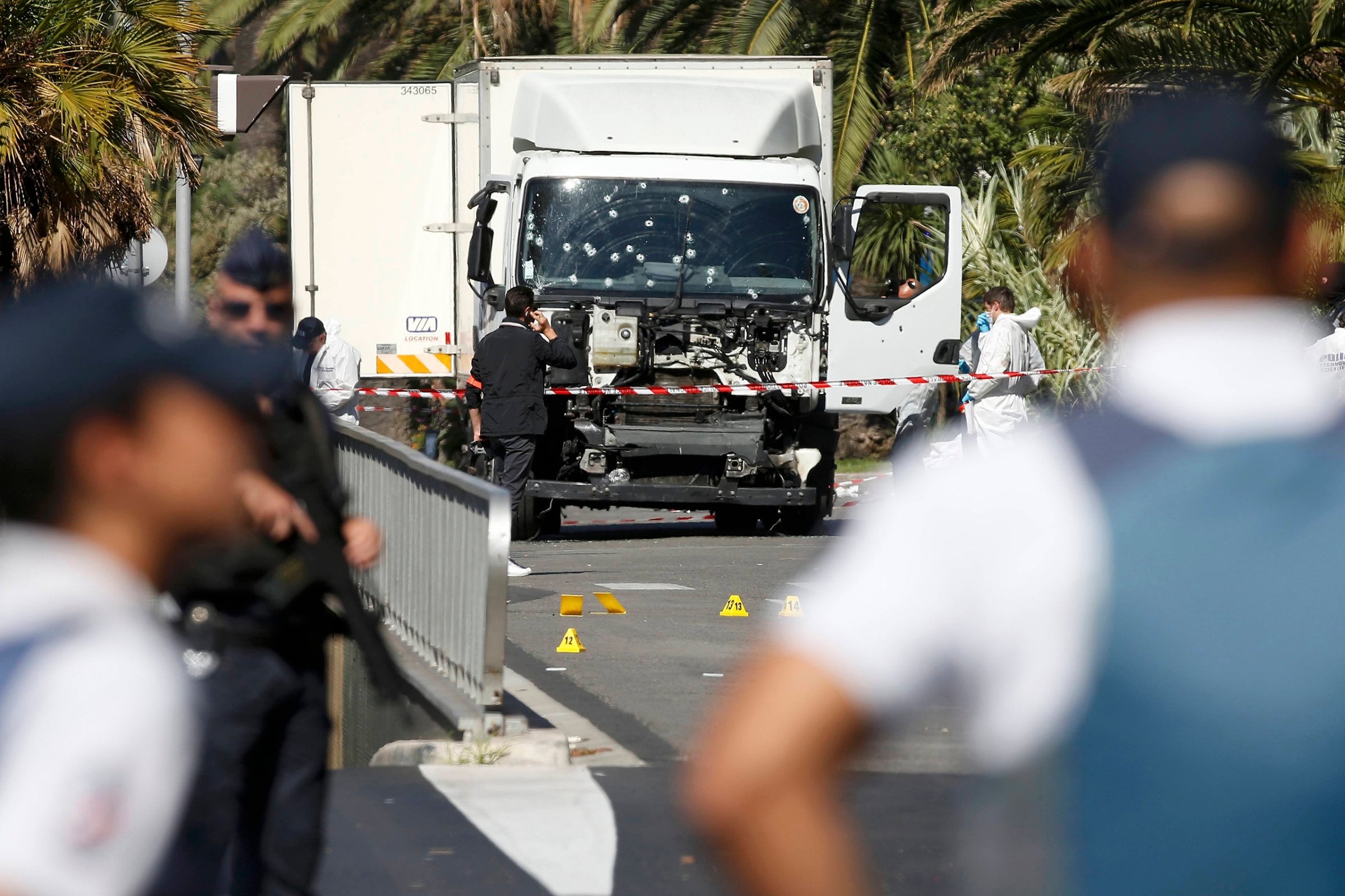 French police secure the area as the investigation continues at the scene near the truck that ran into a crowd at high speed, killing scores who were celebrating Bastille Day on July 14, on the Promenade des Anglais in Nice, France, on July 15, 2016.