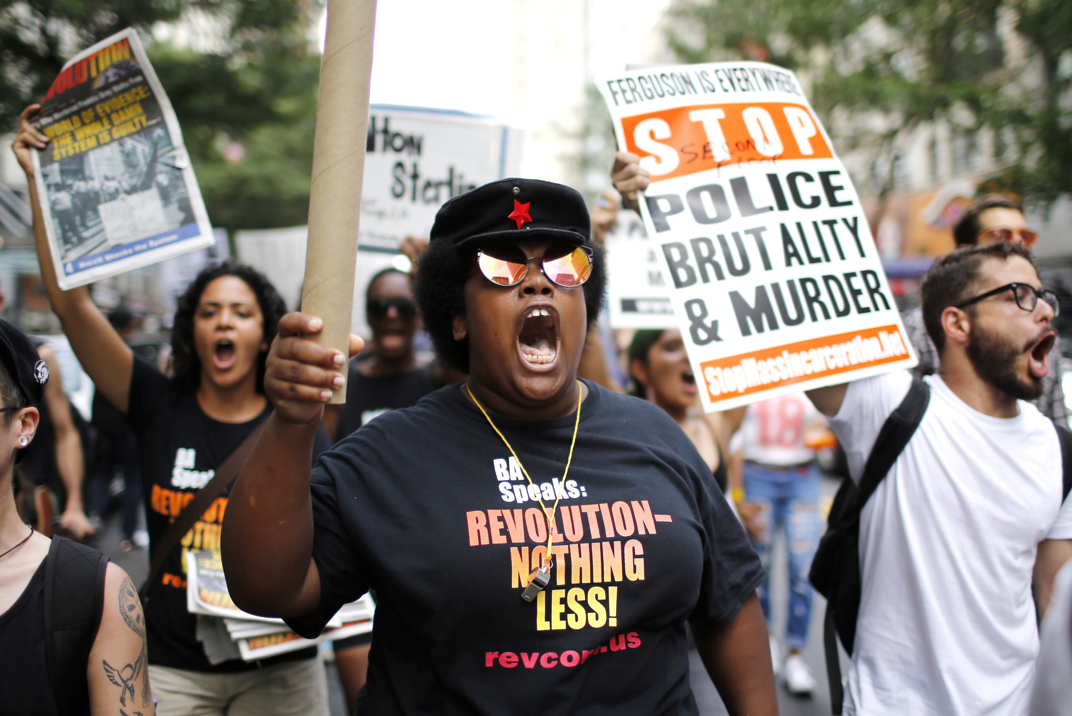 People take part in a protest for the killing of Alton Sterling and Philando Castile during a march along Manhattan's streets in New York