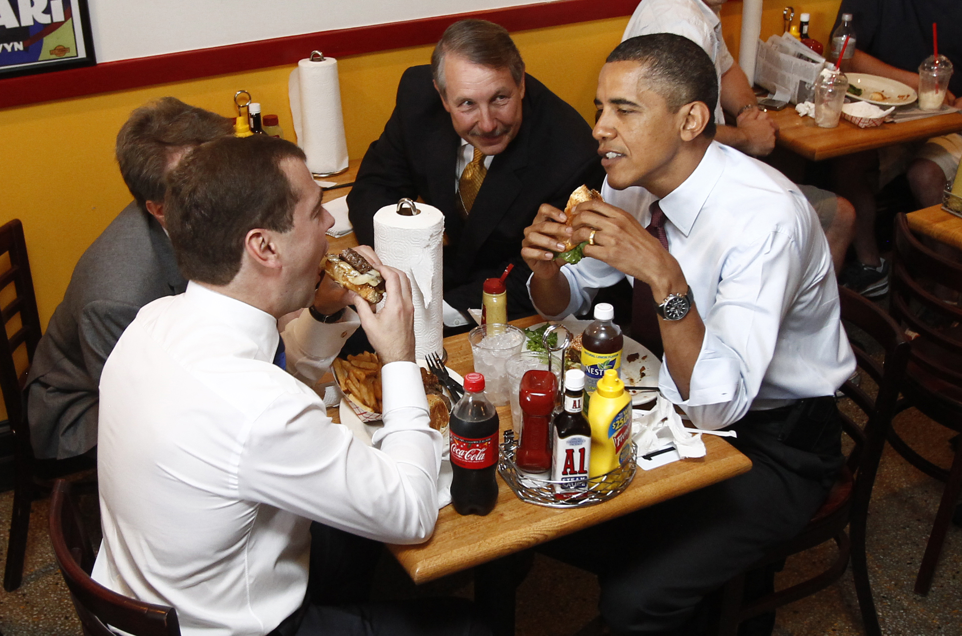 Barack Obama and Russia's President Dmitry Medvedev have burgers at Ray's Hell Burger restaurant in Arlington, Virginia, June 24, 2010. (Kevin Lamarque—Reuters)