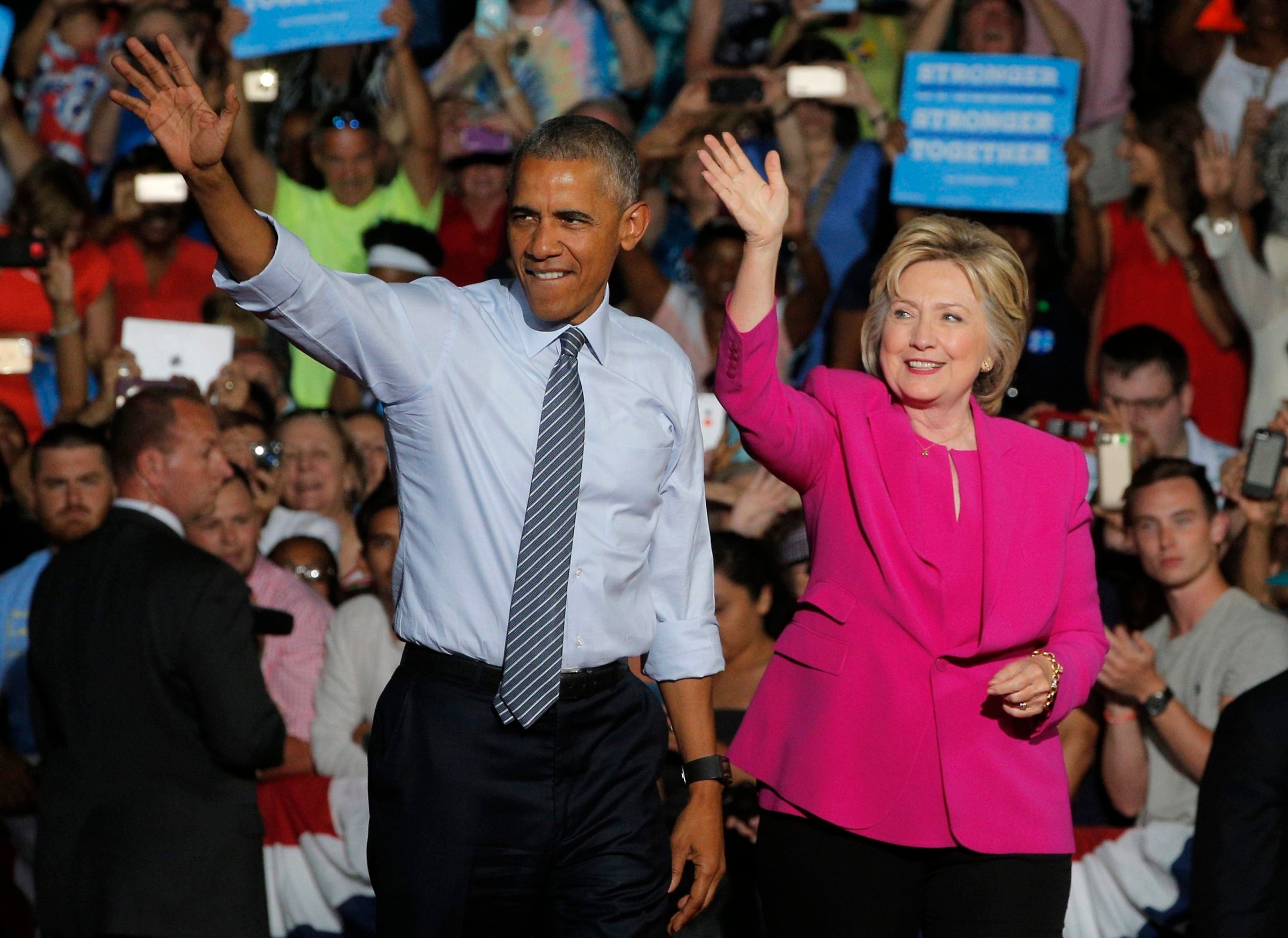 President Barack Obama waves with Democratic U.S. presidential candidate Hillary Clinton during a Clinton campaign event in Charlotte, July 5, 2016.